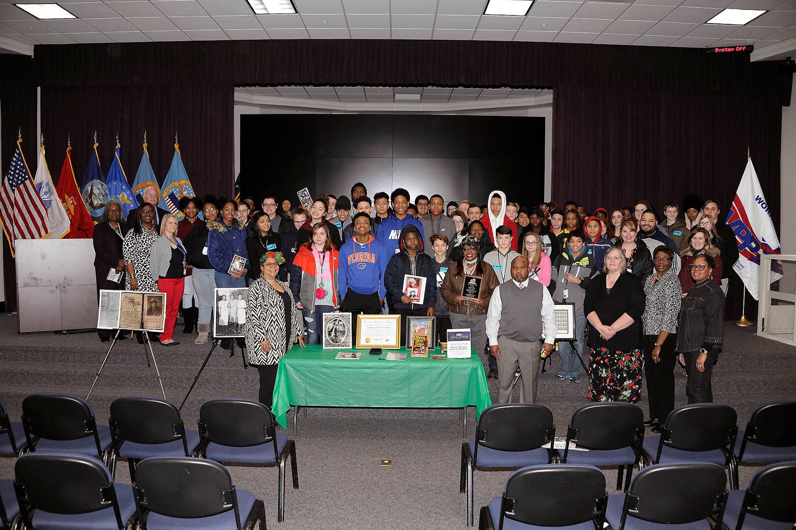 Battle Creek Central High School students pose with educator Gigi Coleman during a Black History Month program at the Hart-Dole-Inouye Federal Center in Battle Creek, Michigan, Feb. 28.