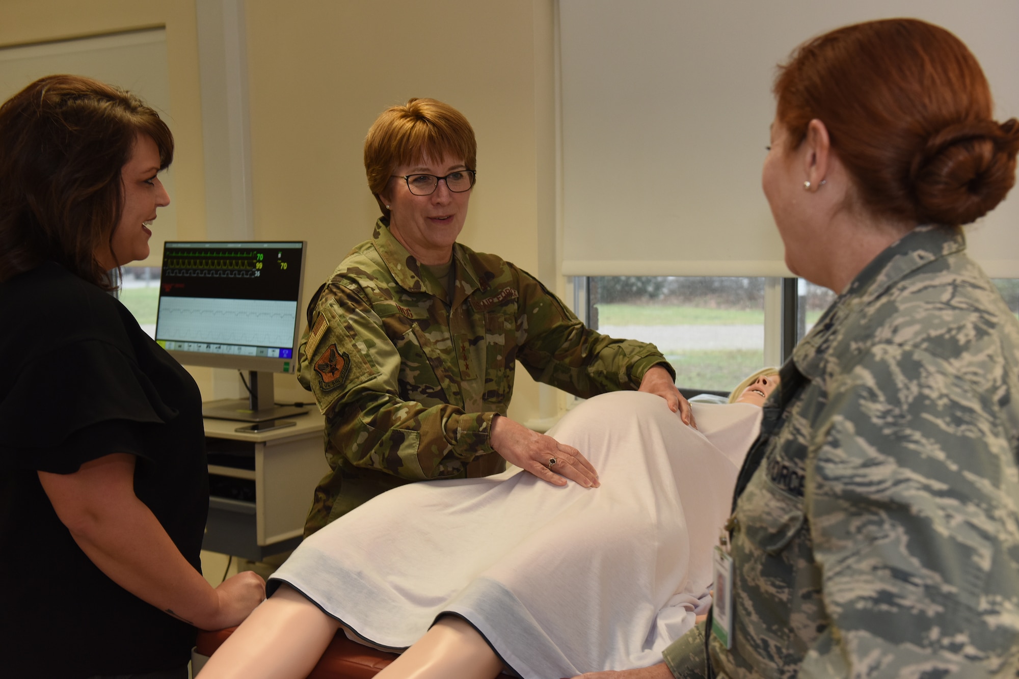 Lt. Gen. Dorothy A. Hogg, U.S. Air Force surgeon general, talks to Col. Jeanine Hatfield, chief nurse executive assigned to the 48th Medical Group, about the simulation tool used by Airmen to improve readiness at RAF Lakenheath, England, Feb. 28, 2019. Hogg toured several facilities in the 48th MDG including the Ambulatory Procedures Unit/Operating Room, Obstetrics/Gynecology Clinic, and the Education and Training Simulation Center. (U.S. Air Force photo by Airman 1st Class Madeline Herzog)