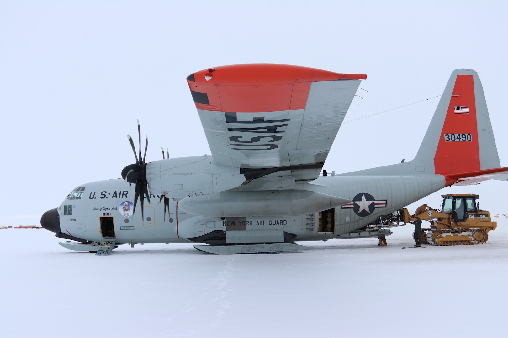 Members of the New York Air National Guard's 109th Airlift Wing load cargo onto an LC-130, ski-equipped aircraft at McMurdo Station, Antarctica on January 15, 2019.