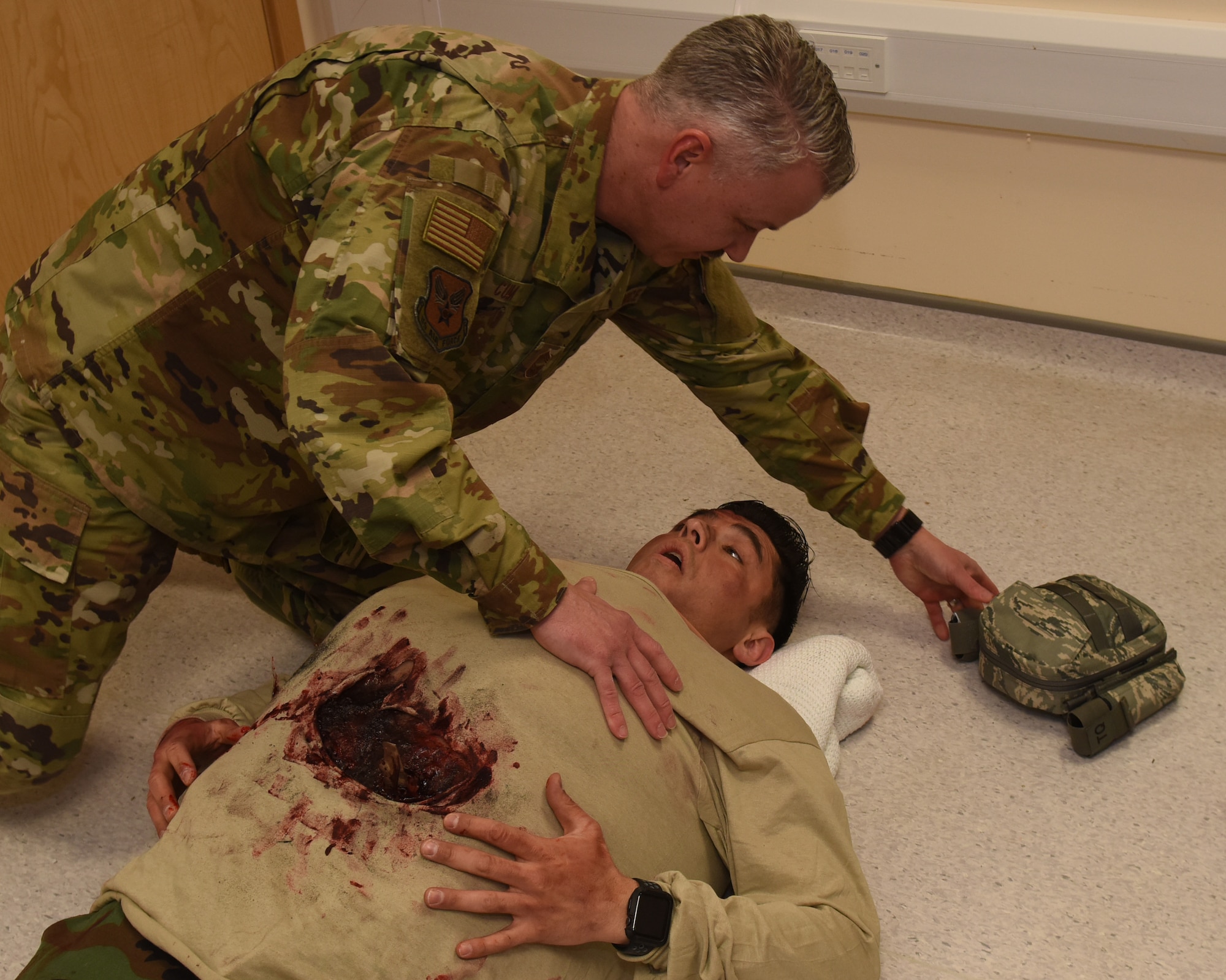 Chief Master Sgt. Steven Cum, U.S. Air Force chief of medical enlisted force and enlisted corps chief, responds to a simulation of an emergency situation at RAF Lakenheath, England, Feb. 28, 2019. The 48th Medical Group ensures the combat capabilities of U.S. military members across six locations within the United Kingdom through medical care and maintains Unites States Air Forces in Europe-Air Forces Africa’s largest hospital. (U.S. Air Force photo by Airman 1st Class Madeline Herzog)