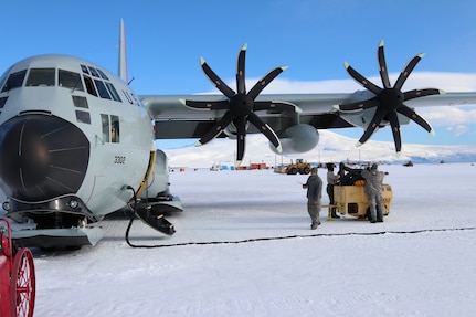 A member of the New York Air National Guard's 109th Airlift Wing performs maintenance on an LC-130, ski-equipped aircraft at McMurdo Station, Antarctica on December 17, 2018