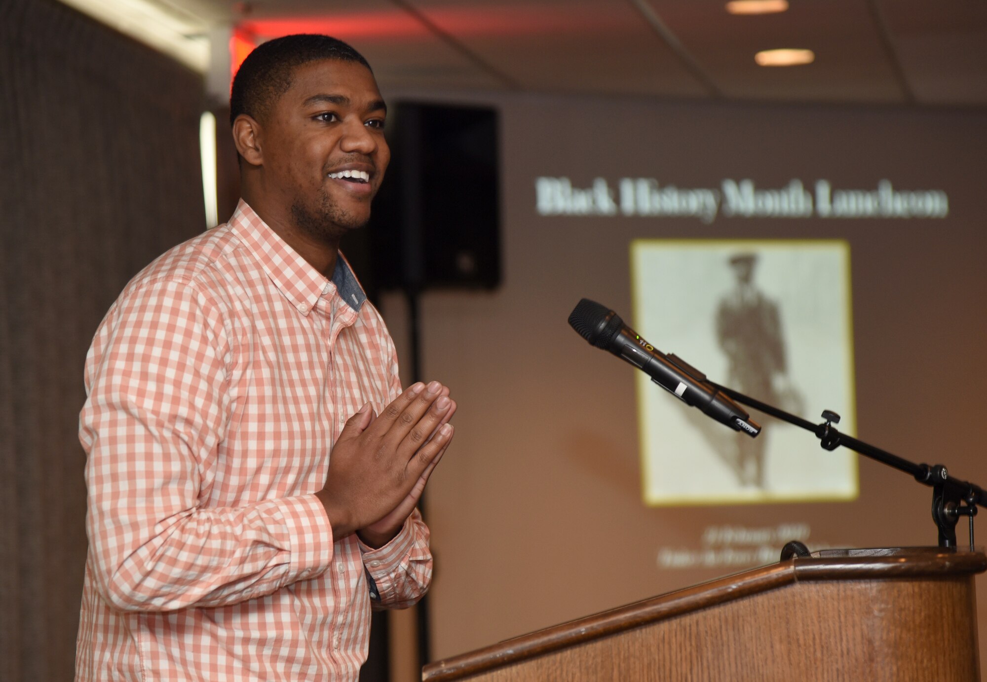 Justin Brothers, with Defense Logistics Agency, presented his poem, 'Hardcore,' at the Black History Month Luncheon Feb. 21.