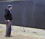 A veteran searches for the name of a friend at "The Wall That Heals" display Feb. 28 at the Fort Sam Houston National Cemetery. Dozens of Vietnam War-era veterans, their families and many others turned out to pay tribute to those who never came home. The Daughters of the American Revolution’s Alamo Chapter hosted “The Wall That Heals,” a traveling representation of the Vietnam Veterans Memorial, at the cemetery Feb. 28 through March 3.