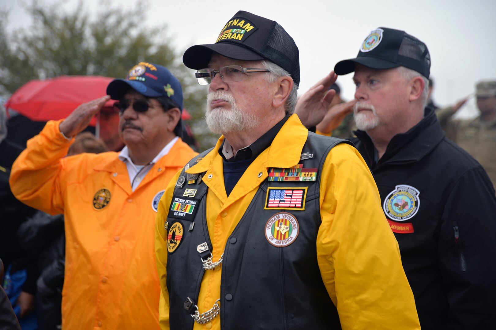 Vietnam War-era Navy veterans pay their respects at the start of the opening ceremonies for "The Wall That Heals" display Feb. 28 at the Fort Sam Houston National Cemetery. Dozens of Vietnam War-era veterans, their families and many others turned out to pay tribute to those who never came home. The Daughters of the American Revolution’s Alamo Chapter hosted “The Wall That Heals,” a traveling representation of the Vietnam Veterans Memorial, at the cemetery Feb. 28 through March 3.