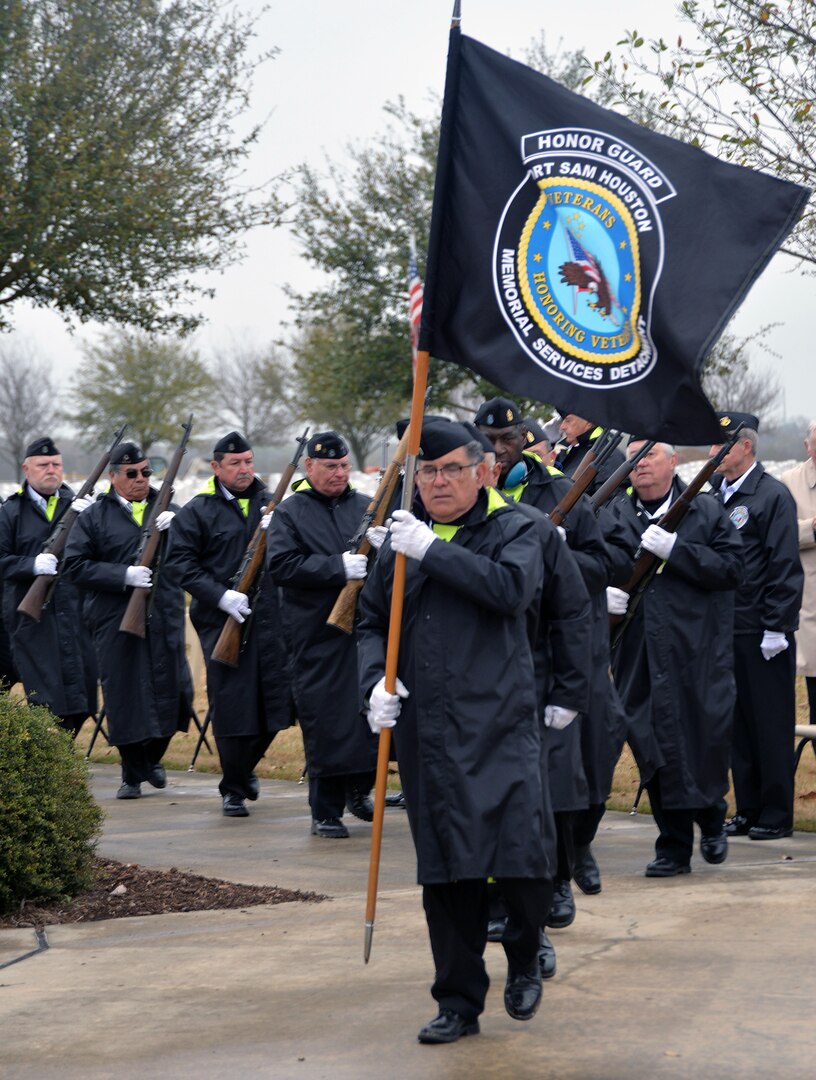 Members of the Fort Sam Houston Memorial Services Detachment bring in the colors at the start of the opening ceremonies for "The Wall That Heals" display Feb. 28 at the Fort Sam Houston National Cemetery. Dozens of Vietnam War-era veterans, their families and many others turned out to pay tribute to those who never came home. The Daughters of the American Revolution’s Alamo Chapter hosted “The Wall That Heals,” a traveling representation of the Vietnam Veterans Memorial, at the cemetery Feb. 28 through March 3.