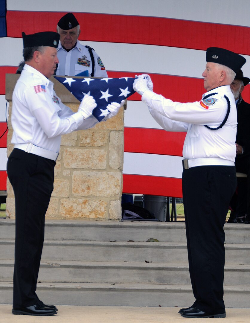 Members of the Fort Sam Houston Memorial Services Detachment conduct a flag-folding ceremony at the conclusion of the opening ceremonies for "The Wall That Heals" display Feb. 28 at the Fort Sam Houston National Cemetery. Dozens of Vietnam War-era veterans, their families and many others turned out to pay tribute to those who never came home. The Daughters of the American Revolution’s Alamo Chapter hosted “The Wall That Heals,” a traveling representation of the Vietnam Veterans Memorial, at the cemetery Feb. 28 through March 3.