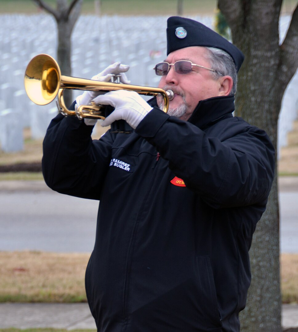 A member of the Fort Sam Houston Memorial Services Detachment plays "Taps" at the conclusion of the opening ceremonies for "The Wall That Heals" display Feb. 28 at the Fort Sam Houston National Cemetery. Dozens of Vietnam War-era veterans, their families and many others turned out to pay tribute to those who never came home. The Daughters of the American Revolution’s Alamo Chapter hosted “The Wall That Heals,” a traveling representation of the Vietnam Veterans Memorial, at the cemetery Feb. 28 through March 3.