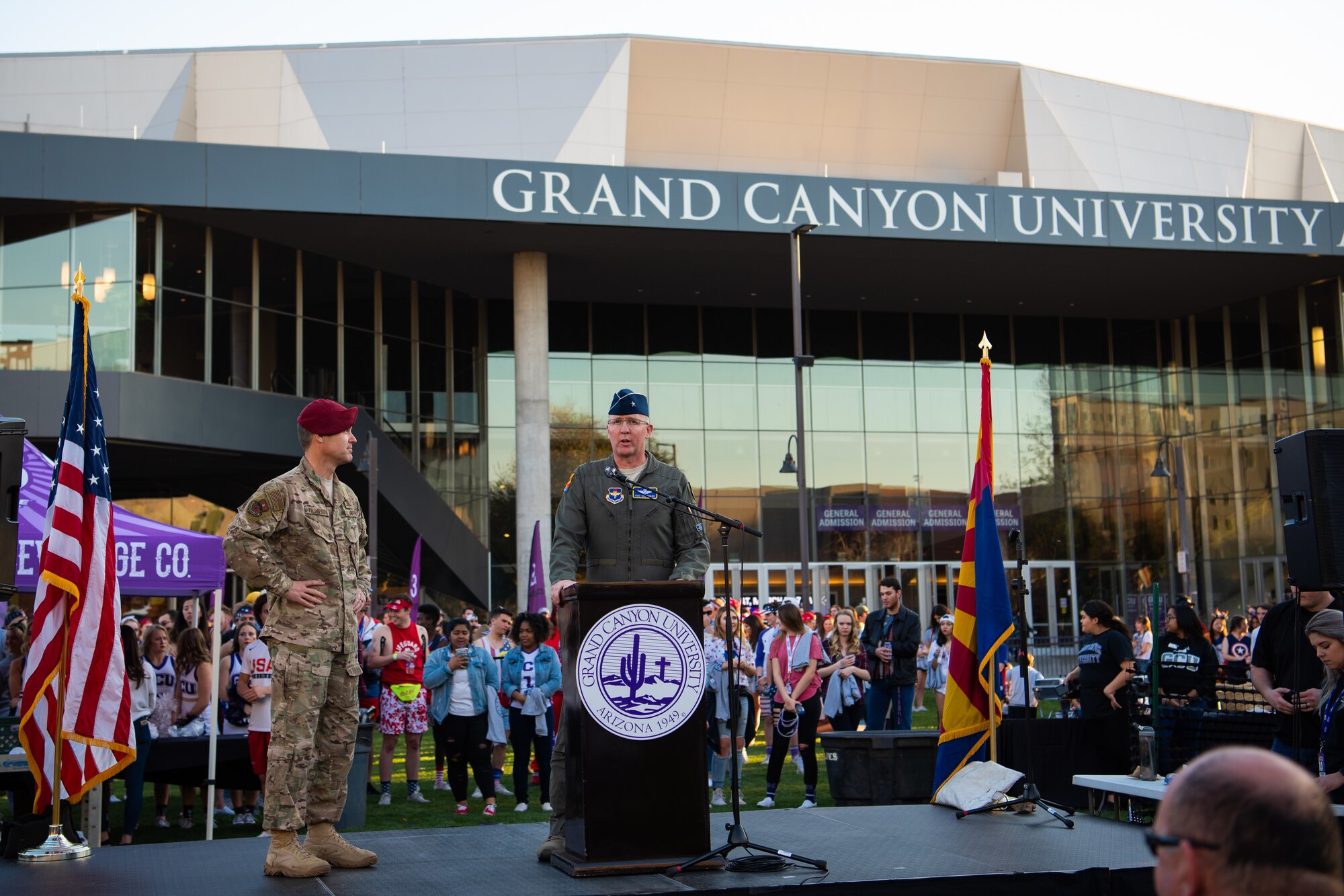 Brig. Gen. Todd Canterbury, 56th Fighter Wing commander and Chief Master Sgt. Ronald Thompson, 56th FW command chief, speak in front of Grand Canyon University students and alumni at a tailgate, Feb. 27, 2019 in Phoenix, Ariz.