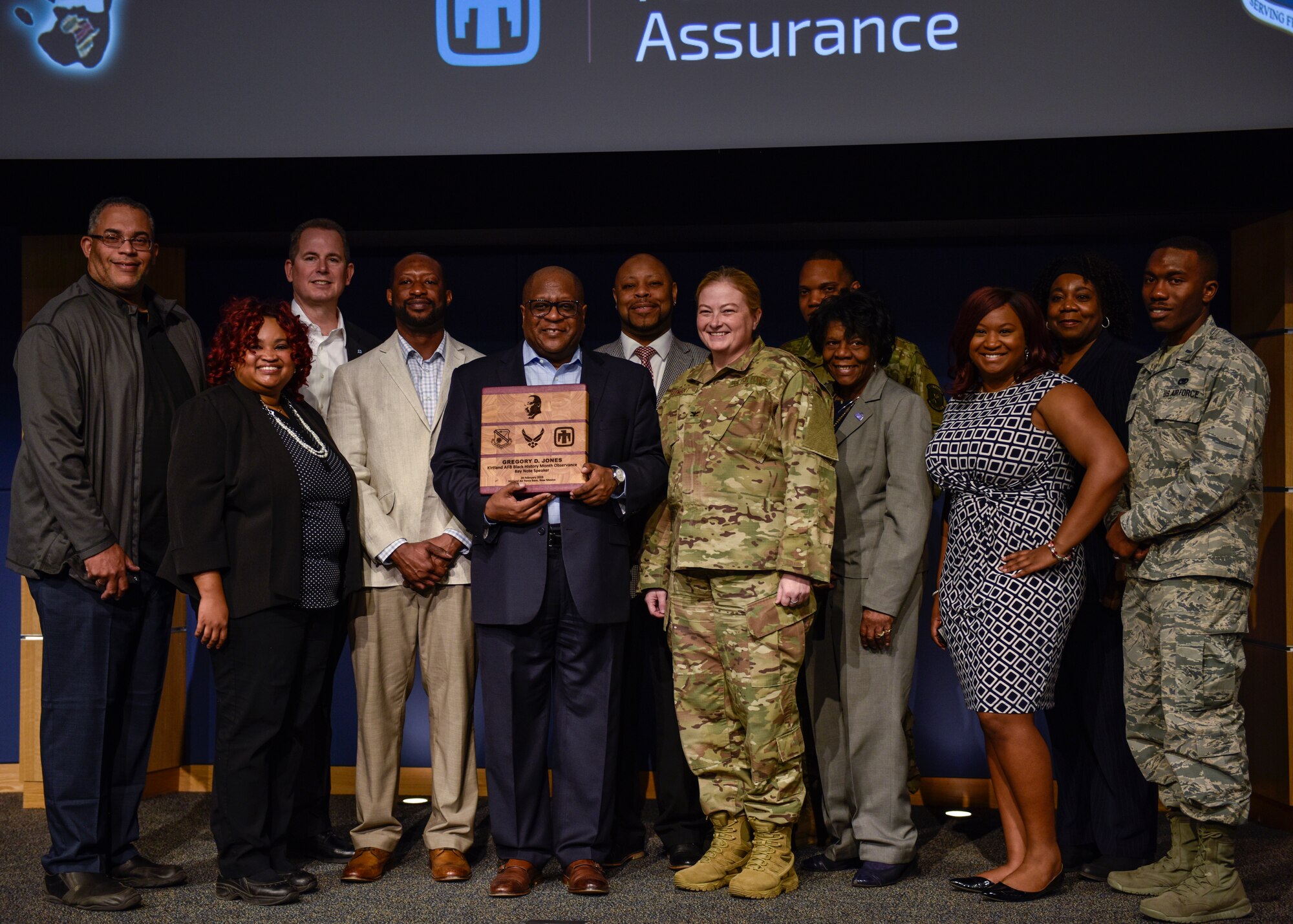 Greg Jones (center), chief diversity officer for United Airlines, poses for a photo with members of Kirtland’s Black History Month committee at Kirtland Air Force Base, N.M., Feb. 28, 2019. Jones, Kirtland’s Black History/African American Month Observance key note speaker, shared approaches and practices he has found more successful in creating a culture where acceptance and appreciation is the norm, and each employee is comfortable bringing his or her full self to work. (U.S. Air Force photo by Airman 1st Class Austin J. Prisbrey)