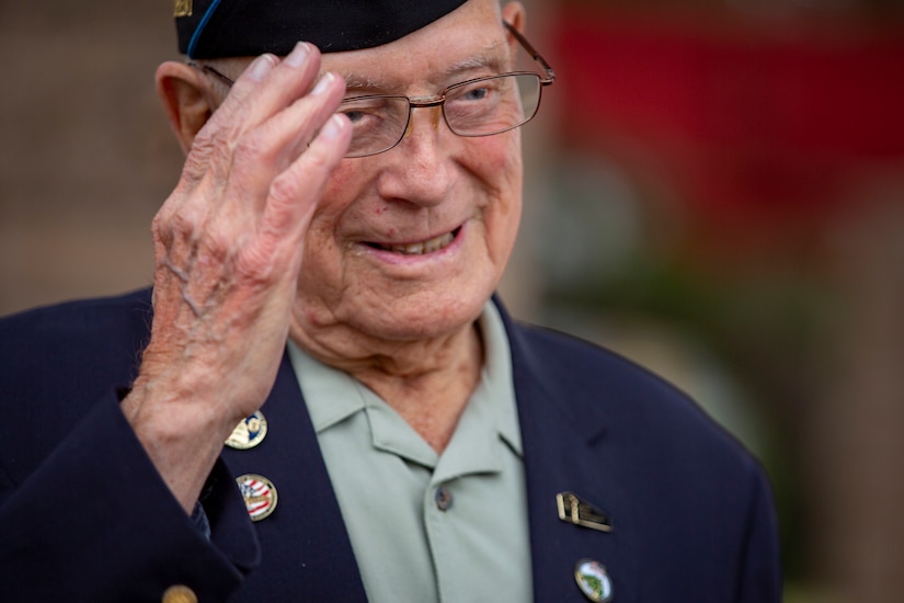 A retired Marine salutes.