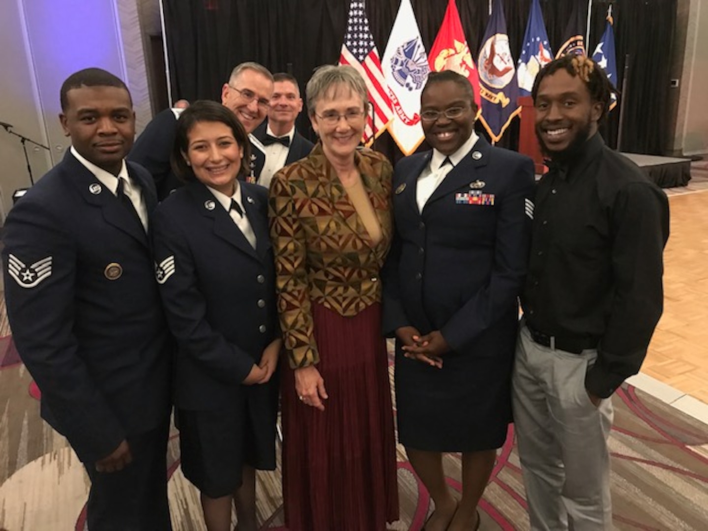 Gen. John Hyten, commander of U.S. Strategic Command (USSTRATCOM), Chief Master Sgt. Patrick McMahon, senior enlisted leader, and other USSTRATCOM members take a photo with Secretary of the Air Force Heather Wilson during the USSTRATCOM Birthday Ball Sept. 22, 2017 in Omaha Nebraska.