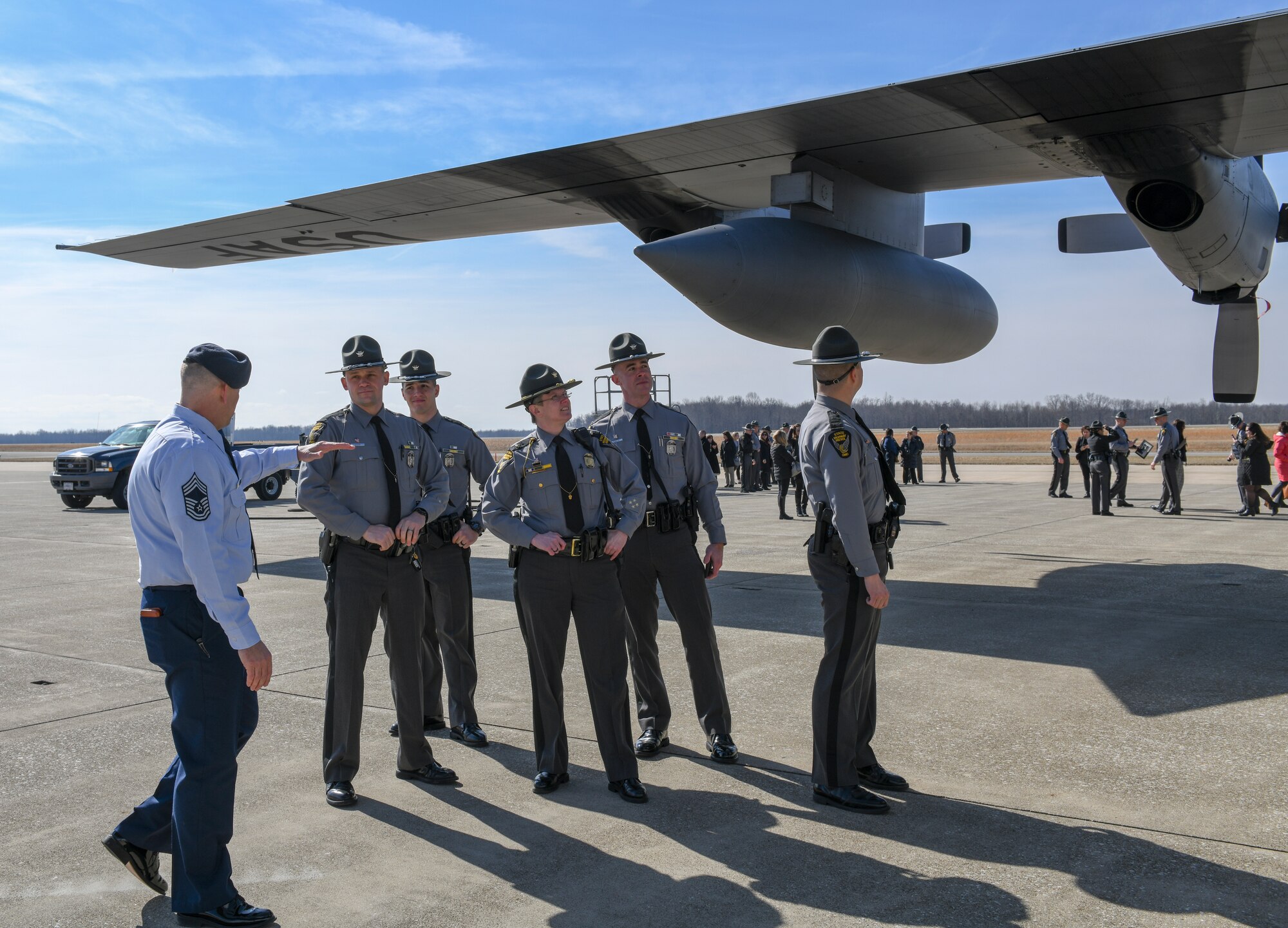 Chief Master Sgt. Les D. Brode, security forces manager with the 910th Security Forces Squadron and employee of the Ohio State Highway patrol, explains various functions of the C-130H Hercules aircraft to members of the OSHP on the flight line here, March 1, 2019.