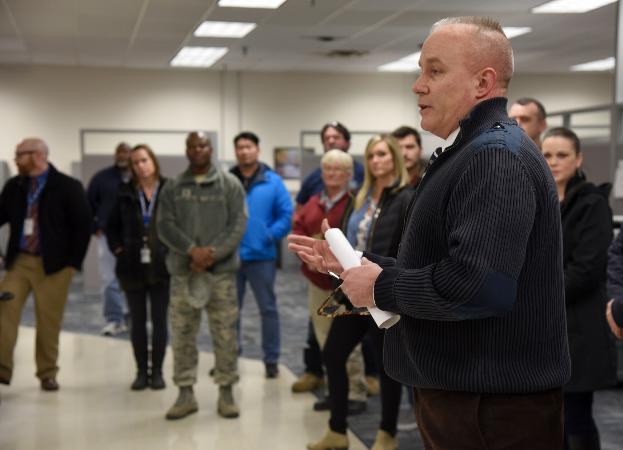 Jerome Smith, chief of the Personal Property Processing Office, speaks with members of Team Tinker about Art of the Possible processes and continuous process improvements the Personal Property Processing Office has gone through Feb. 22. About 30 people from across the base toured various sections of the 72nd Logistics Readiness Squadron as part of an ongoing initiative to showcase various organizations within the 72nd Air Base Wing. (U.S. Air Force photos/Kelly White)