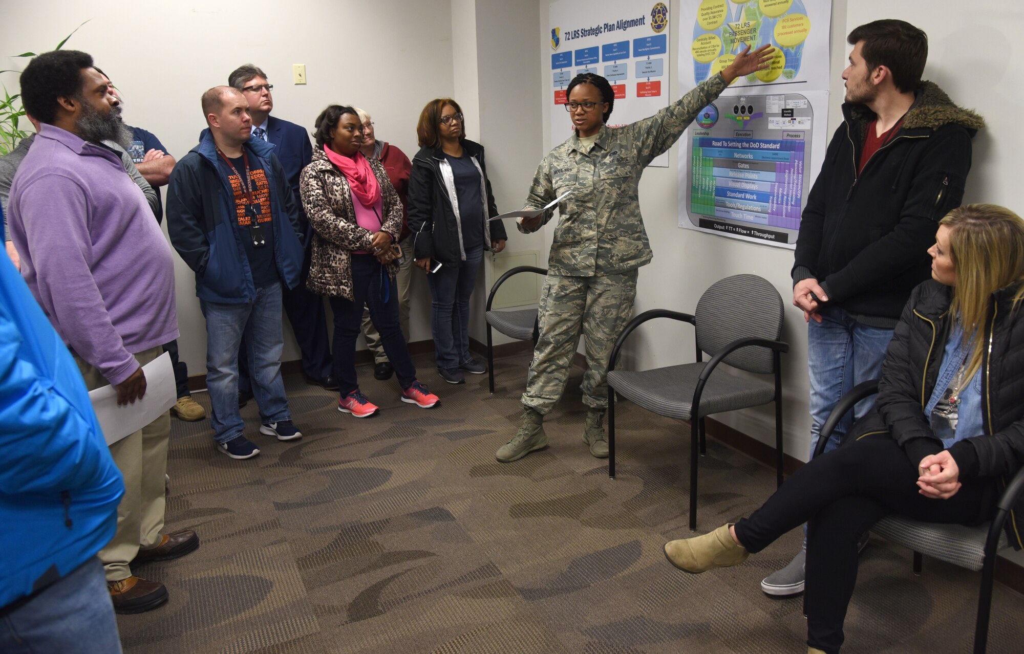 Staff Sgt. Chaelon Moultry, with the 72nd Logistics Readiness Squadron Passenger Movement Office, speaks about how her office helps over 26,000 DoD military and civilians and 18,000 dependents annually. About 30 people from across the base toured various sections of the 72nd Logistics Readiness Squadron as part of an ongoing initiative to showcase various organizations within the 72nd Air Base Wing. (U.S. Air Force photos/Kelly White)