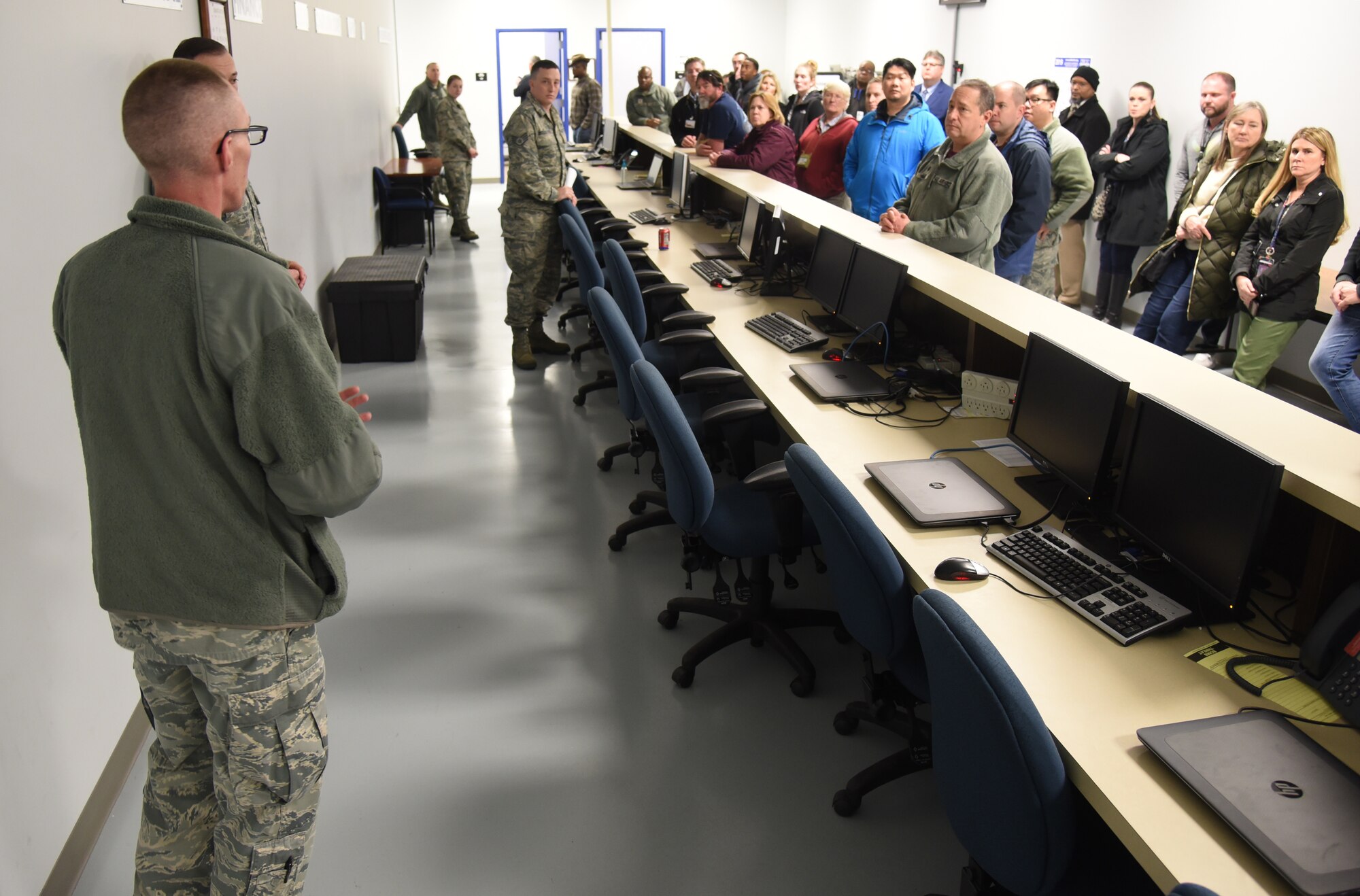Tech. Sgt. Joshua Gale, non-commissioned officer in charge of terminal operations, discusses the Personal Deployment Function line for deployers and how they make sure their mobility folder is up-to-date for their deployment. (U.S. Air Force photos/Kelly White)