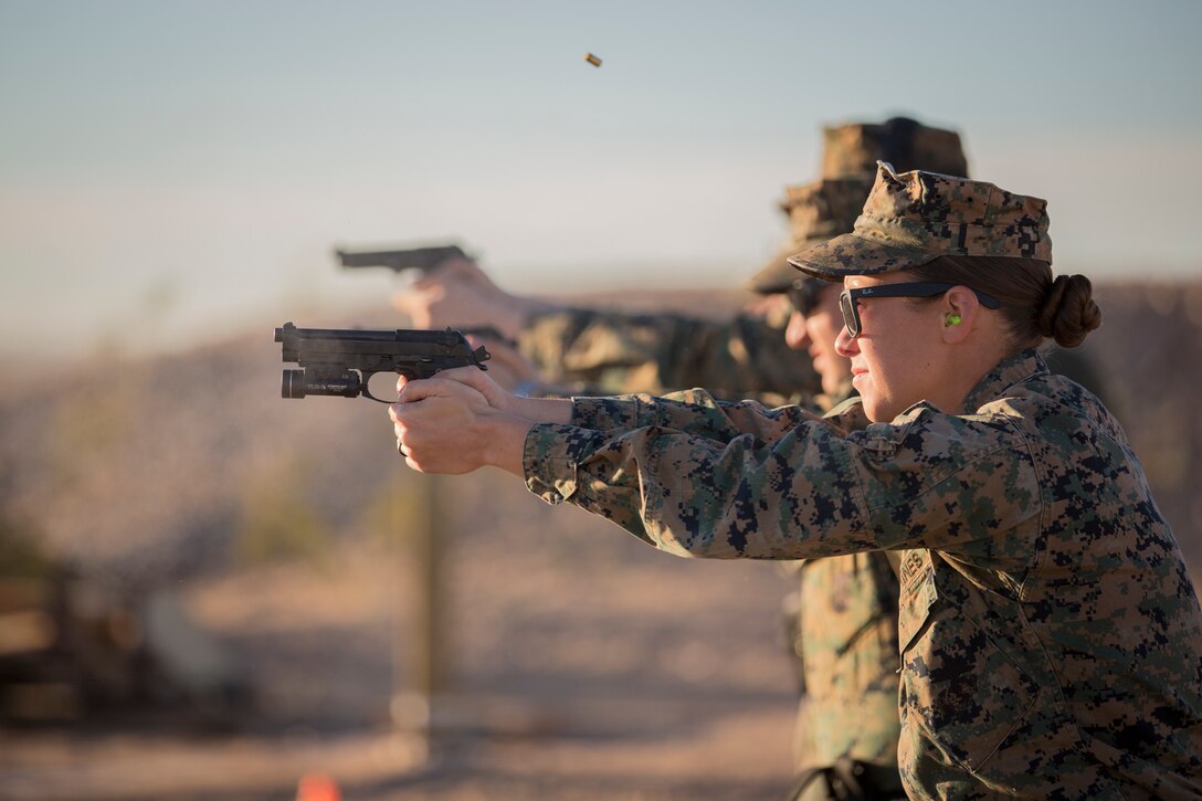 U.S. Marines with the Provost Marshal's Office (PMO), Headquarters and Headquarters Squadron (H&HS), Marine Corps Air Station (MCAS) Yuma, engage targets during a law enforcement (LE) range qualification on MCAS Yuma Ariz., Feb. 28, 2019. The LE qualification is specific to military police personnel, including several different shooting methods with both the Beretta M9 pistol and Benelli 12 gauage shotgun. (U.S. Marine Corps photo by Sgt. Allison Lotz)