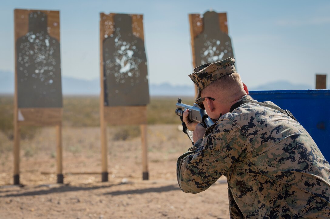 U.S. Marines with the Provost Marshal's Office (PMO), Headquarters and Headquarters Squadron (H&HS), Marine Corps Air Station (MCAS) Yuma, engage targets during a law enforcement (LE) range qualification on MCAS Yuma Ariz., Feb. 28, 2019. The LE qualification is specific to military police personnel, including several different shooting methods with both the Beretta M9 pistol and Benelli 12 gauage shotgun. (U.S. Marine Corps photo by Sgt. Allison Lotz)