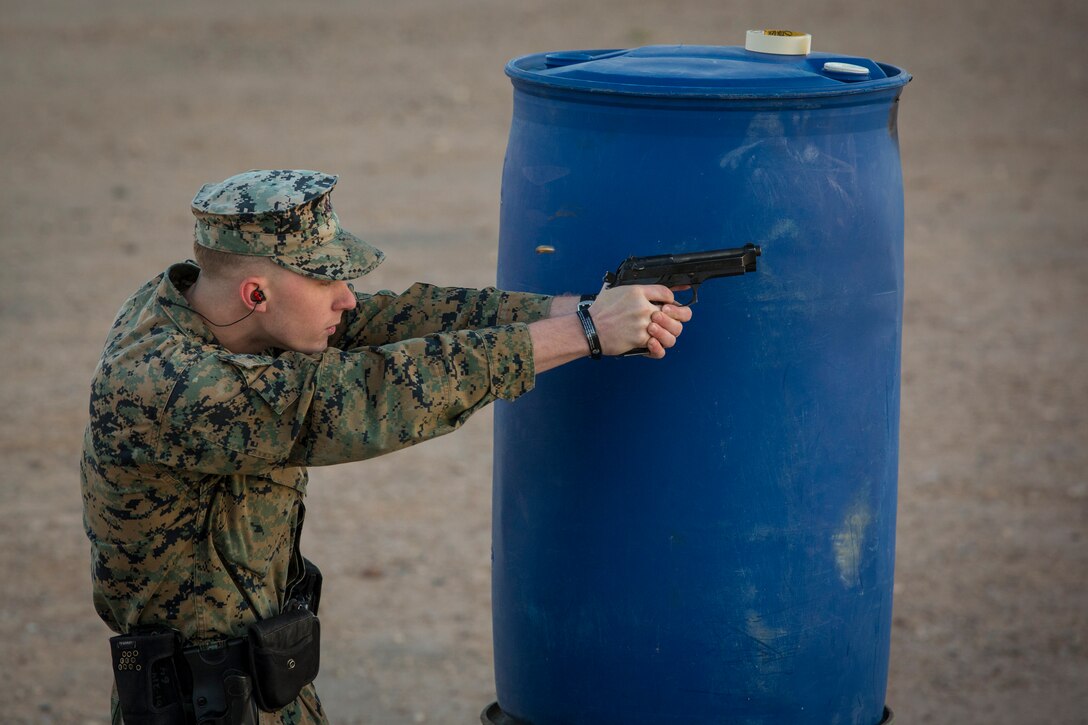 U.S. Marines with the Provost Marshal's Office (PMO), Headquarters and Headquarters Squadron (H&HS), Marine Corps Air Station (MCAS) Yuma, engage targets during a law enforcement (LE) range qualification on MCAS Yuma Ariz., Feb. 28, 2019. The LE qualification is specific to military police personnel, including several different shooting methods with both the Beretta M9 pistol and Benelli 12 gauage shotgun. (U.S. Marine Corps photo by Sgt. Allison Lotz)