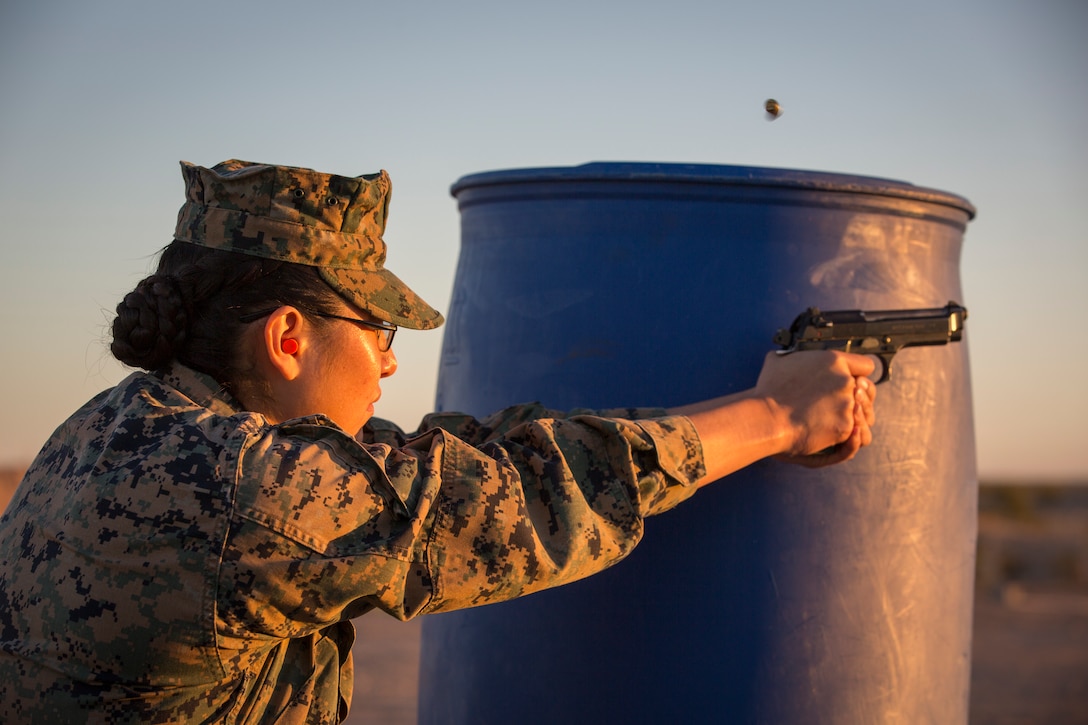 U.S. Marines with the Provost Marshal's Office (PMO), Headquarters and Headquarters Squadron (H&HS), Marine Corps Air Station (MCAS) Yuma, engage targets during a law enforcement (LE) range qualification on MCAS Yuma Ariz., Feb. 28, 2019. The LE qualification is specific to military police personnel, including several different shooting methods with both the Beretta M9 pistol and Benelli 12 gauage shotgun. (U.S. Marine Corps photo by Sgt. Allison Lotz)