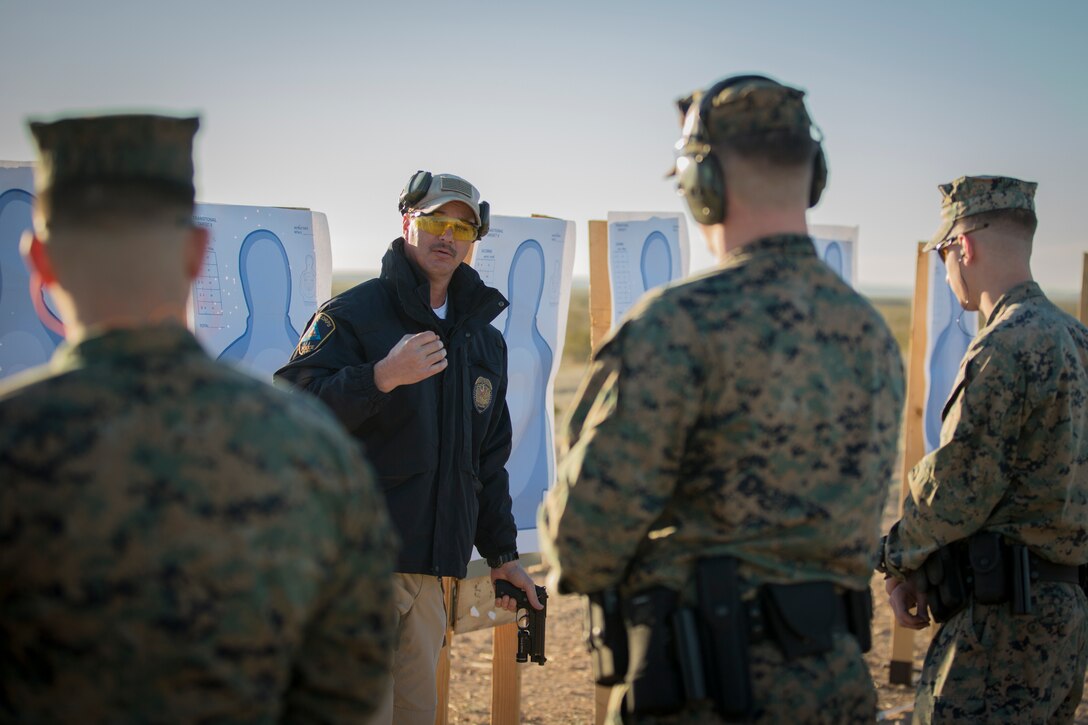 U.S. Marines with the Provost Marshal's Office (PMO), Headquarters and Headquarters Squadron (H&HS), Marine Corps Air Station (MCAS) Yuma, engage targets during a law enforcement (LE) range qualification on MCAS Yuma Ariz., Feb. 28, 2019. The LE qualification is specific to military police personnel, including several different shooting methods with both the Beretta M9 pistol and Benelli 12 gauage shotgun. (U.S. Marine Corps photo by Sgt. Allison Lotz)