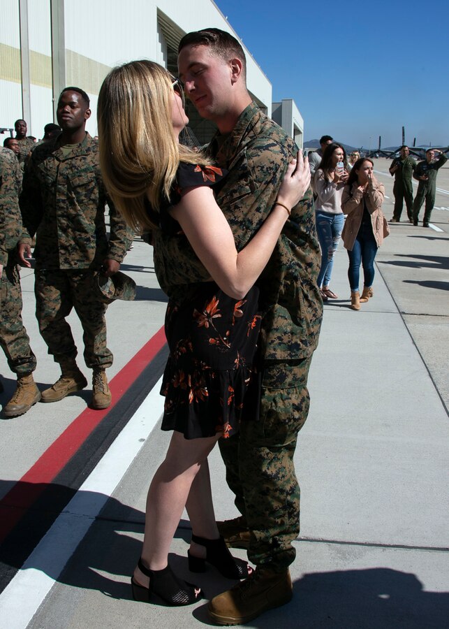 Sgt. James Galichia, a flight line mechanic with Marine Medium Tiltrotor Squadron (VMM) 166, Marine Aircraft Group (MAG) 16, 3rd Marine Aircraft Wing (MAW), kisses his girlfriend after returning home to Marine Corps Air Station Miramar, Calif., Feb. 27, following a deployment with the 13th Marine Expeditionary Unit. More than 5,000 Marines and Sailors of the Essex Amphibious Readiness Group, and the embarked 13th MEU, conducted maritime security operations to support regional stability, reassure partners and allies, and maintain a presence postured to respond to any crisis ranging from humanitarian assistance to contingency operations. (Marine Corps photo by Cpl. Joshua S. McAlpine)