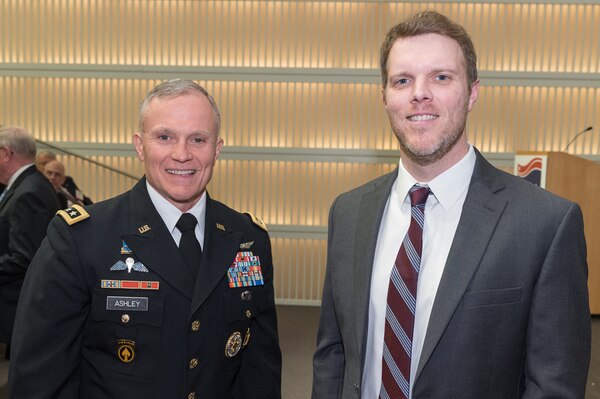 Defense Intelligence Agency Director Lt. Gen. Robert Ashley, Jr. left, and DIA employee Travis Thompson, recipient of the Richard J. Kerr Government Award, pose for a photo during the 2019 Intelligence and National Security Alliance Achievement Award ceremony, Feb. 21, in Washington, D.C.