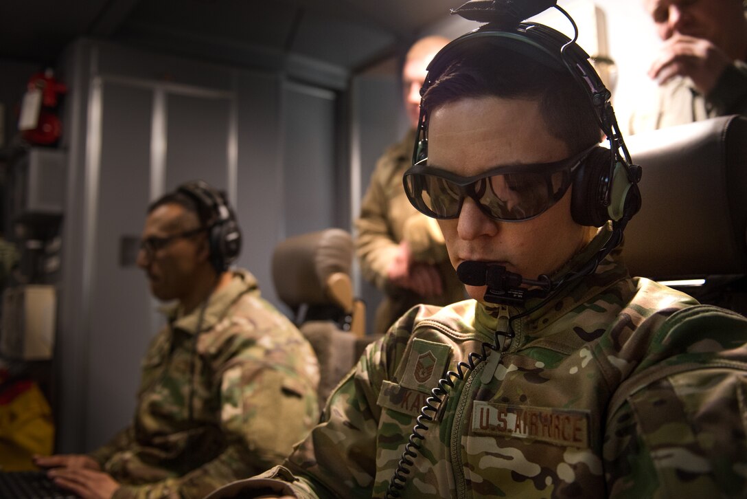 Master Sgt. Devin Kay, 344th Air Refueling Squadron instructor boom operator, follows a checklist after take-off from McConnell Air Force Base, Kan., Feb. 28, 2019. Kay is in charge of teaching how to operate the new refueling system to the 344th boom operators. The 3-D glasses are part of the new capabilities of the new aircraft the Air Force accepted Jan. 25, 2019. (U.S. Air Force photo by Staff. Sgt. David Bernal Del Agua)