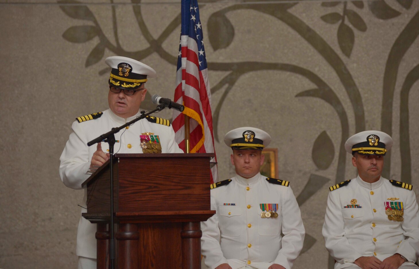 SANTA RITA, Guam (March 1, 2019) - Capt. Timothy Poe, Commander, Submarine Squadron Fifteen, addresses attendees during a change of command ceremony for the Los Angeles-class fast attack submarine USS Topeka (SSN 754), March 1. Topeka is one of four Guam-homeported submarines assigned COMSUBRON 15.