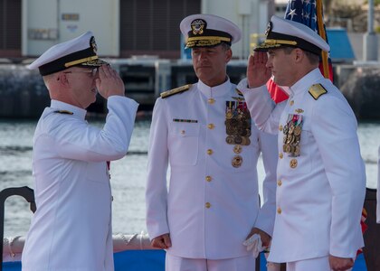 Rear Adm. Blake Converse, right, relieves Rear Adm. Daryl L. Caudle, left, as the commander of Submarine Force, U.S. Pacific Fleet during a change of command ceremony aboard the Virginia-class fast attack submarine USS Mississippi (SSN 782) in Joint Base Pearl Harbor-Hickam. (U.S. Navy photo by Mass Communication Specialist 2nd Class Shaun Griffin/Released)