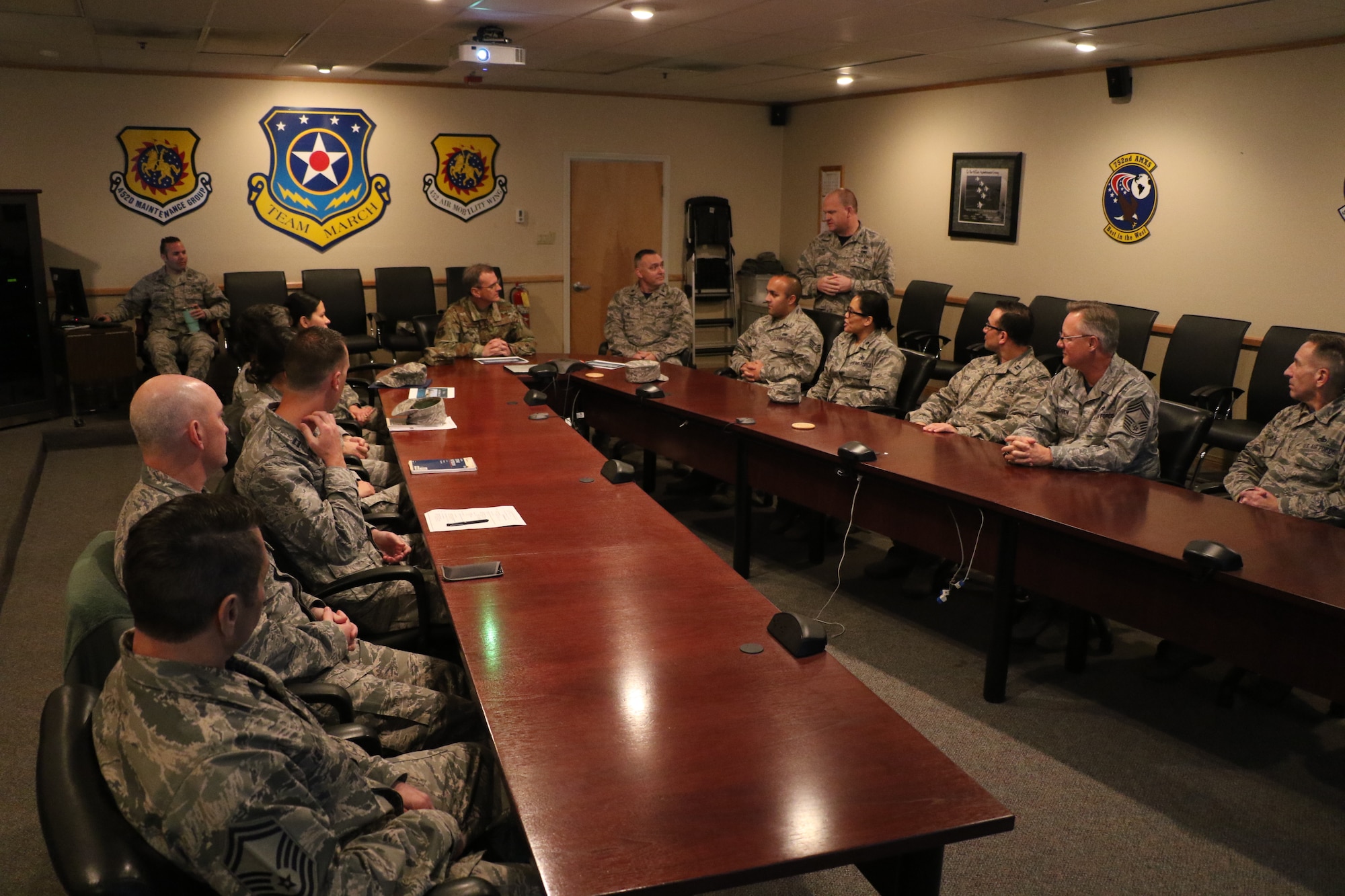 U.S. Air Force Maj. Gen. Randall Ogden (center), commander, Fourth Air Force, March Air
Reserve Base, listens to a mission briefing here by U.S. Air Force Col. Aaron Heick (right
standing), commander, 452nd Maintenance Group, March ARB, Feb 10, 2019. 4AF senior
leadership toured March ARB to learn about the 452nd AMW’s mission, capabilities and
challenges as part of a multi-day unit visit.
