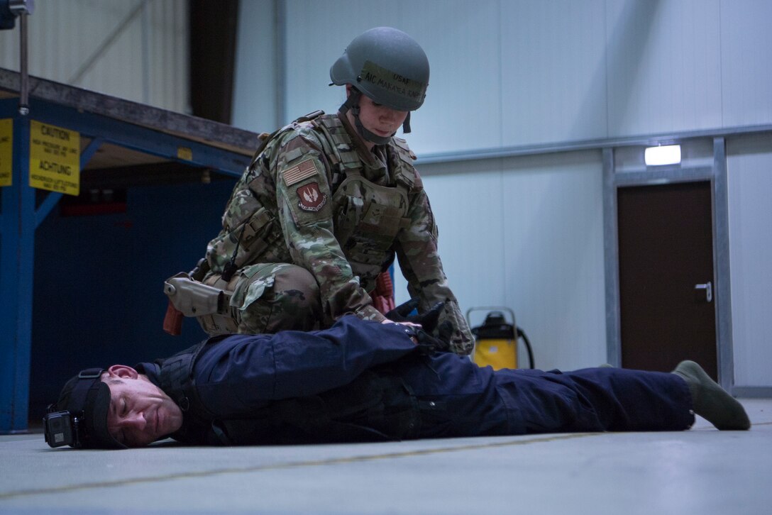 U.S. Air Force Security Forces member detains a simulated active shooter during an exercise. (U.S. Air Force photo by Senior Airman Devin M. Rumbaugh)