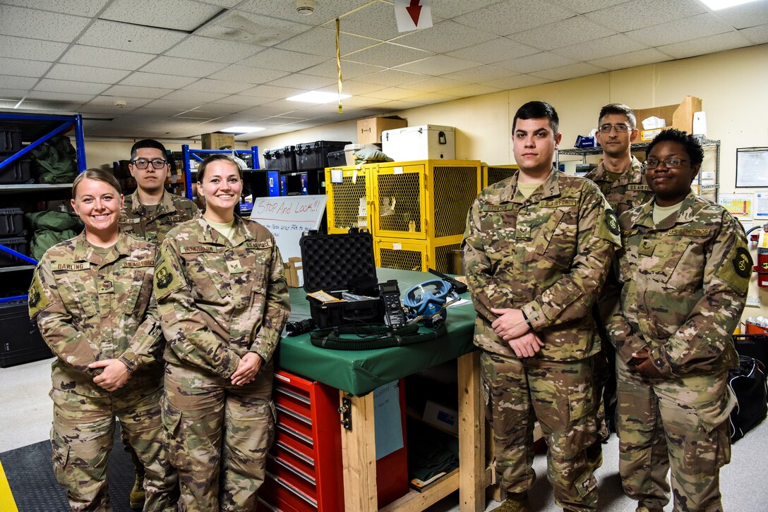 The 380th Expeditionary Operational Support Squadron aircrew flight equipment pose for a group photo at Al Dhafra Air Base, United Arab Emirates, Feb. 26, 2019.