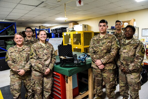 The 380th Expeditionary Operational Support Squadron aircrew flight equipment pose for a group photo at Al Dhafra Air Base, United Arab Emirates, Feb. 26, 2019.