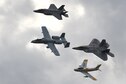 A U.S. Air Force A-10 Thunderbolt II, F-22 Raptor, F-35 Lightning and an F-86 Sabre fly in formation together over Davis-Monthan Air Force Base, Ariz., March 2, 2019.