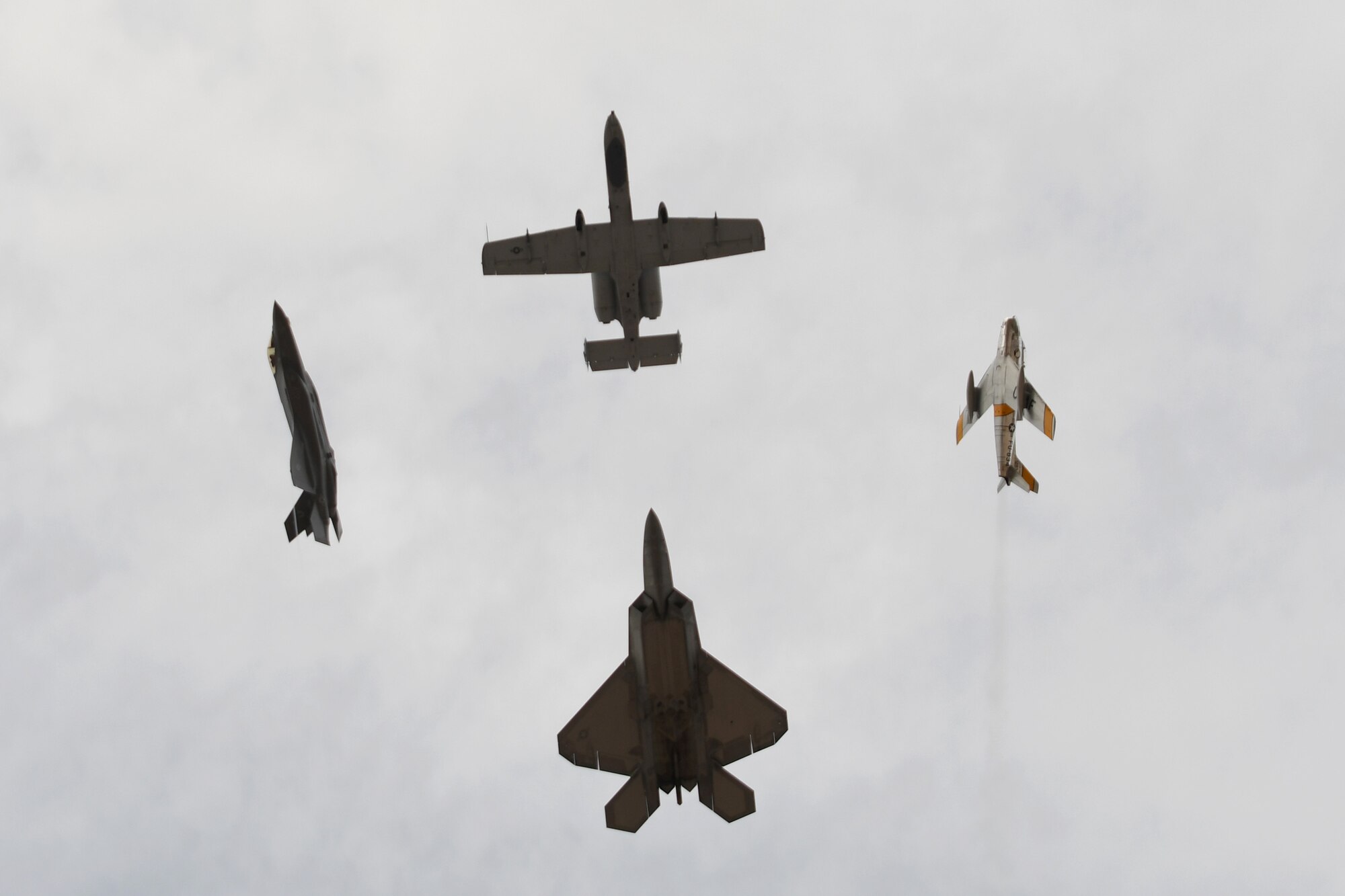 A U.S. Air Force A-10 Thunderbolt II, F-22 Raptor, F-35 Lightning and an F-86 Sabre fly in formation together over Davis-Monthan Air Force Base, Ariz., March 2, 2019.