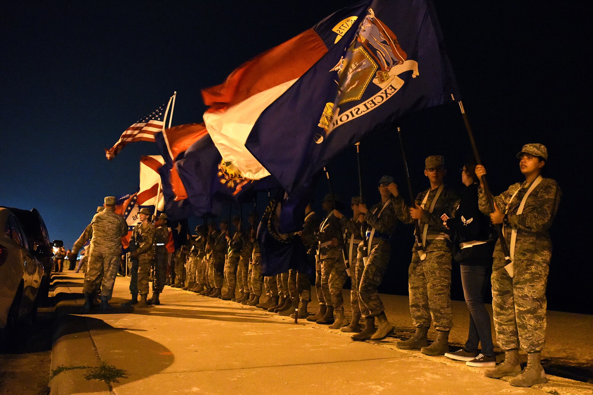 Airmen from the 81st Training Group hold the 50 flags during the Sepcial Tactics Memorial Ruck March in Biloxi, Mississippi, March 1, 2019. Twenty Special Tactics Airmen ruck from Medina Annex at Lackland Air Force Base, Texas, to Hurlburt Field, Florida, to pay tribute to Staff Sgt. Dylan J. Elchin, who was killed in Afghanistan on Nov. 27, 2018, and 19 other Special Tactics Airmen who have been killed in action since 9/11. The ruck march takes ST members across five states and 830 miles. (U.S. Air Force photo by Senior Airman Suzie Plotnikov)