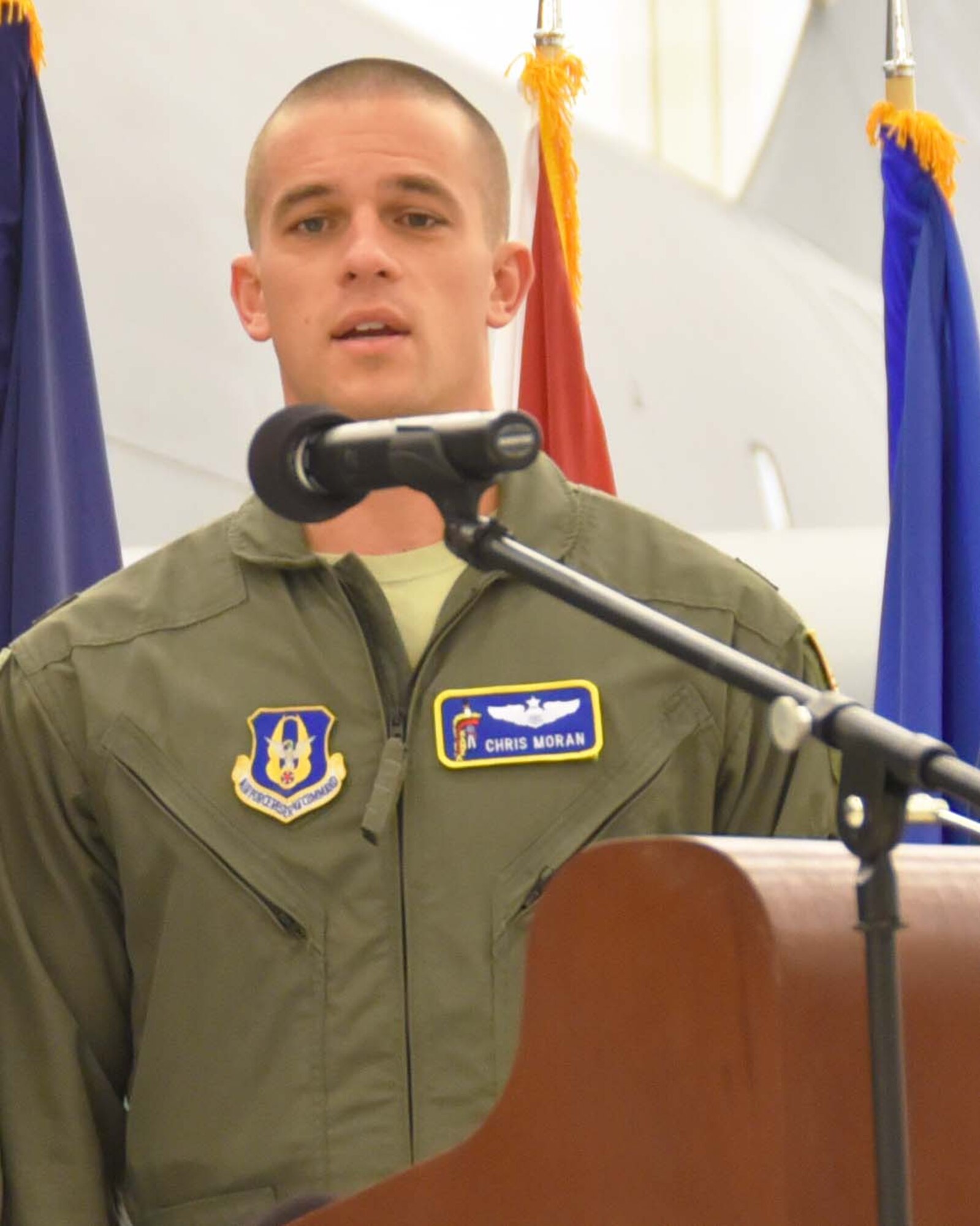 Maj. Christopher Moran, 924th Air Refueling Squadron KC-135 pilot and Traditional Reservist, sings with members of his Barbershop group, Smorgaschorus, during the 18th Air Refueling Squadron Change of Command ceremony Dec. 2, 2018, McConnell Air Force Base, Kan.  Moran, a 924th Air Refueling Squadron KC-135 pilot and Traditional Reservist, has been a member of the local group for more than three years.