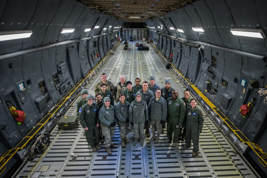 Citizen Airmen with 932nd Airlift Wing, Aeromedical Evacuation Squadron, pose for a photo after initial training on the C-5M Super Galaxy,  March 2, 2019, Scott Air Force Base, Illinois. The training prepares AES members to become more efficient in transferring patients on the C-5M Super Galaxy. (U.S. Air Force photo by Senior Airman Brooke Deiters)
