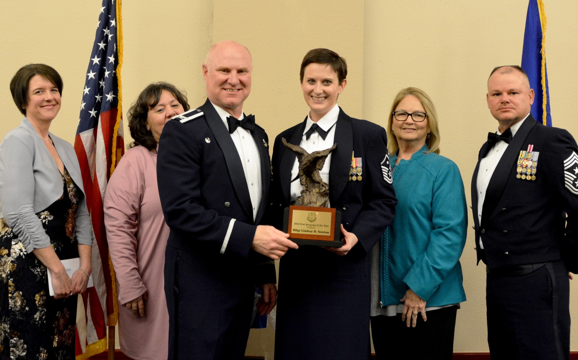 Col. Miles Heaslip, 507th Air Refueling Wing commander, and Chief Master Sgt. David Dickson, 507th ARW command chief, along with wing community partners, present the 2018 507th ARW 1st Sgt. of the Year award to Master Sgt. Lindsay Newton, 507th Aircraft Maintenance Squadron, March 2, 2019, in Midwest City, Oklahoma. (U.S. Air Force photo by Maj. Jon Quinlan)