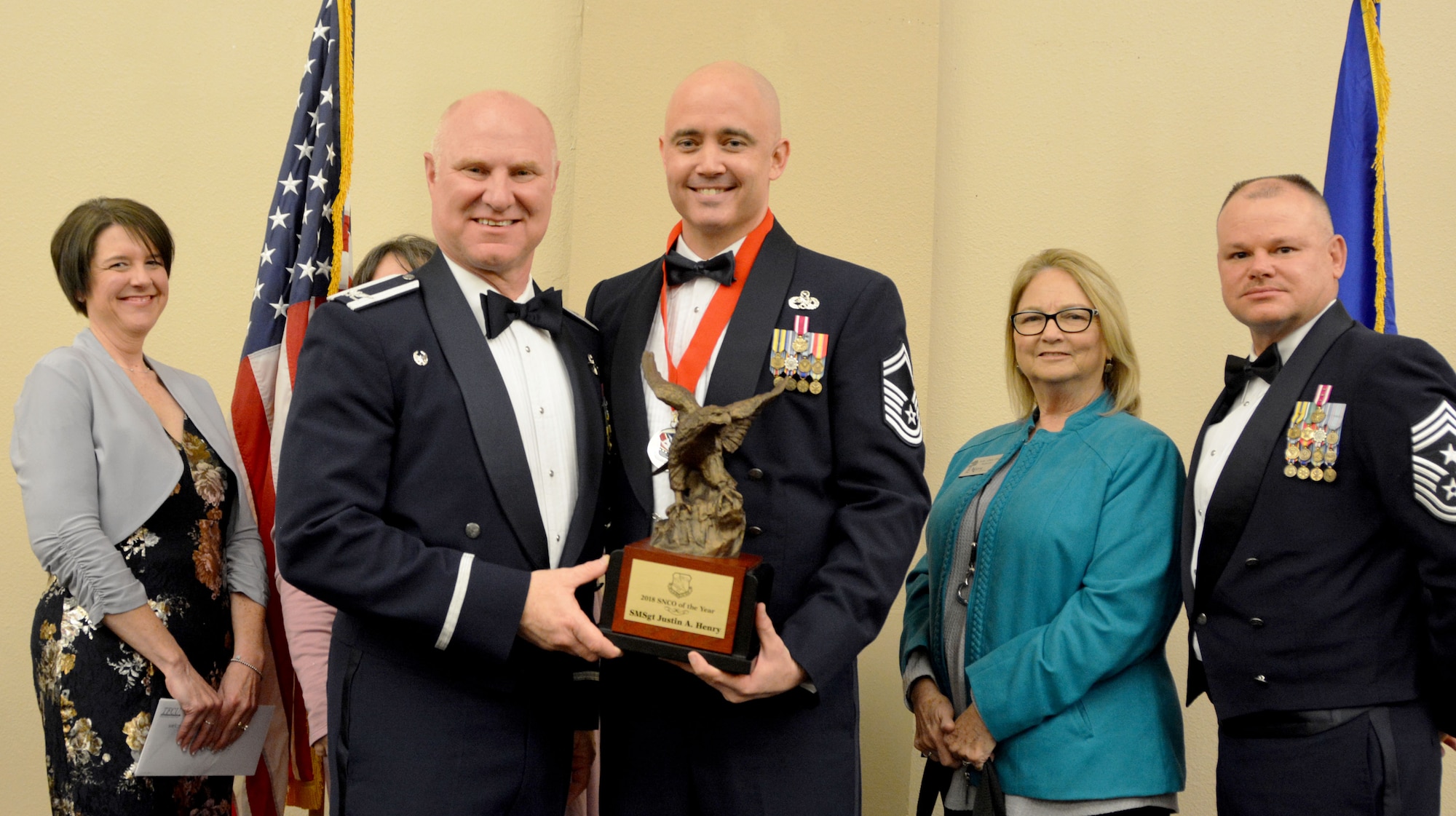 Col. Miles Heaslip, 507th Air Refueling Wing commander, and Chief Master Sgt. David Dickson, 507th ARW command chief, along with wing community partners, present the 2018 507th ARW Senior Noncommissioned Officer of the Year award to Senior Master Sgt. Justin Henry, 507th Aircraft Maintenance Squadron, March 2, 2019, in Midwest City, Oklahoma. (U.S. Air Force photo by Maj. Jon Quinlan)