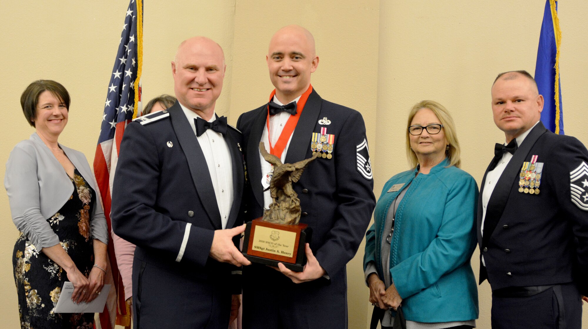 Col. Miles Heaslip, 507th Air Refueling Wing commander, and Chief Master Sgt. David Dickson, 507th ARW command chief, along with wing community partners, present the 2018 507th ARW Senior Noncommissioned Officer of the Year award to Senior Master Sgt. Justin Henry, 507th Aircraft Maintenance Squadron, March 2, 2019, in Midwest City, Oklahoma. (U.S. Air Force photo by Maj. Jon Quinlan)