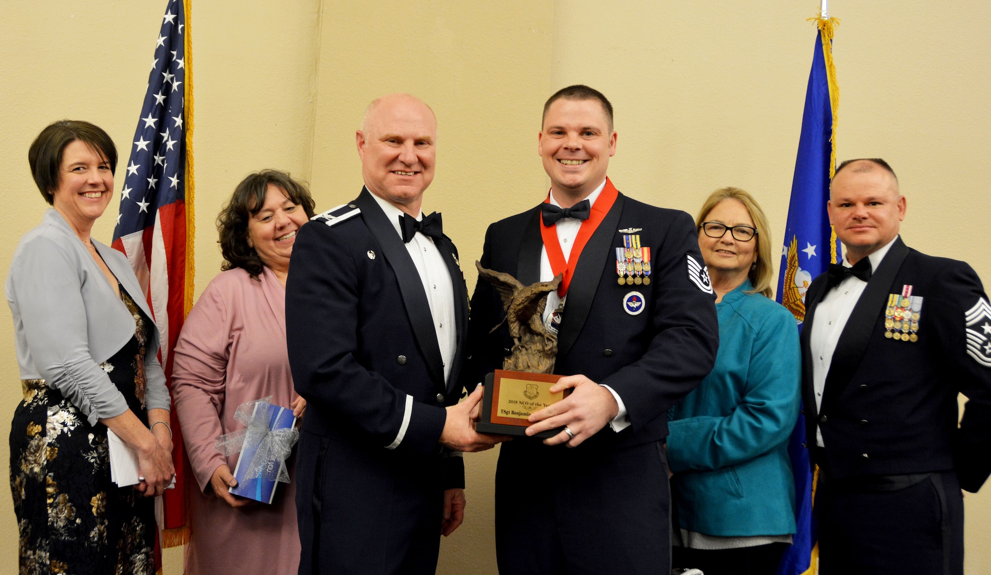 Col. Miles Heaslip, 507th Air Refueling Wing commander, and Chief Master Sgt. David Dickson, 507th ARW command chief, along with community partners, present the 2018 507th ARW Noncommissioned Officer of the Year award to Tech. Sgt. Benjamin Alexander, 730th Air Mobility Training Squadron, March 2, 2019, in Midwest City, Oklahoma. (U.S. Air Force photo by Maj. Jon Quinlan)