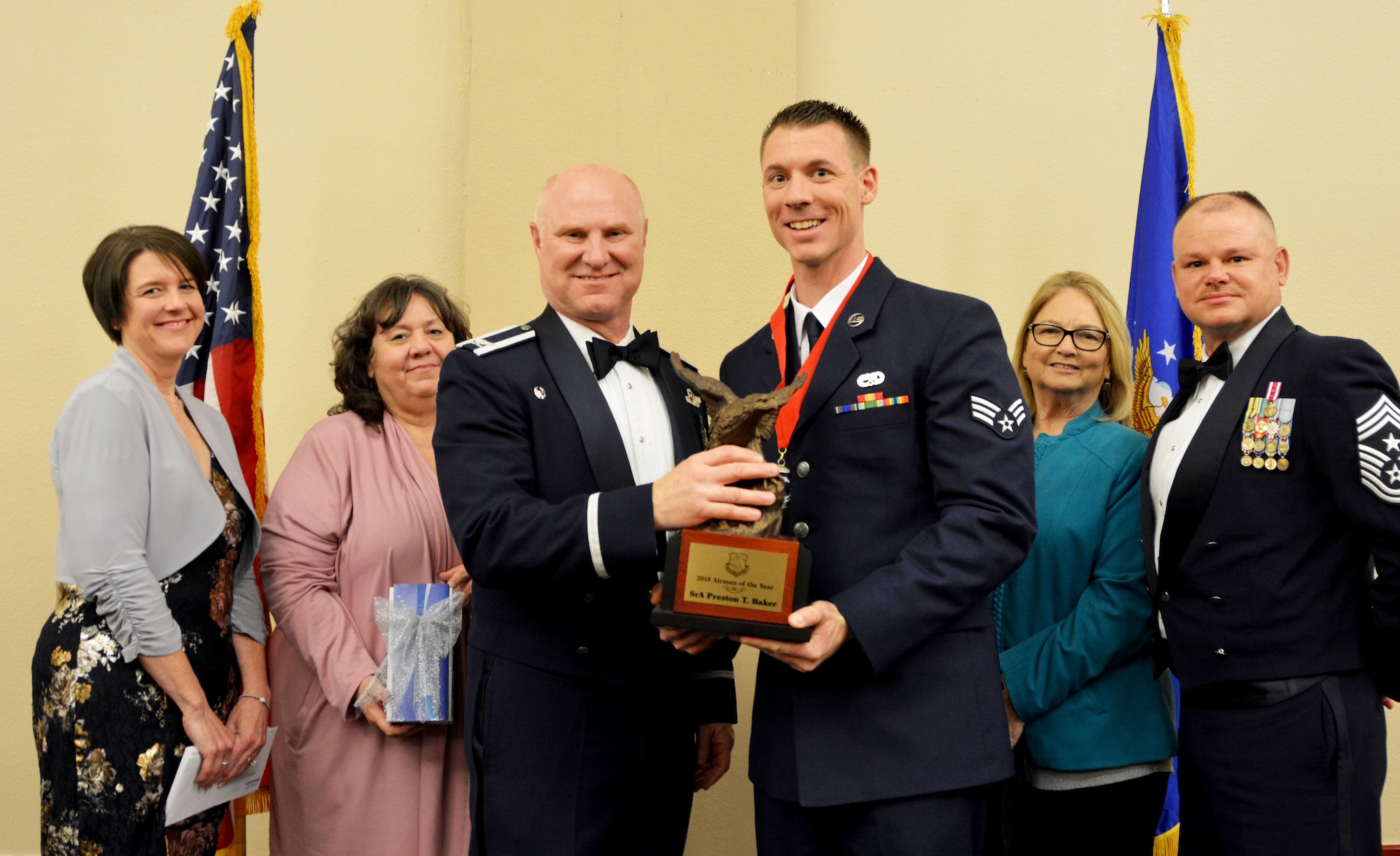 Col. Miles Heaslip, 507th Air Refueling Wing commander, and Chief Master Sgt. David Dickson, 507th ARW command chief, along with wing community partners, present the 2018 Airman of the Year award to Senior Airman Preston Baker, 507th Aircraft Maintenance Squadron, March 2, 2019, in Midwest City, Oklahoma. (U.S. Air Force photo by Maj. Jon Quinlan)