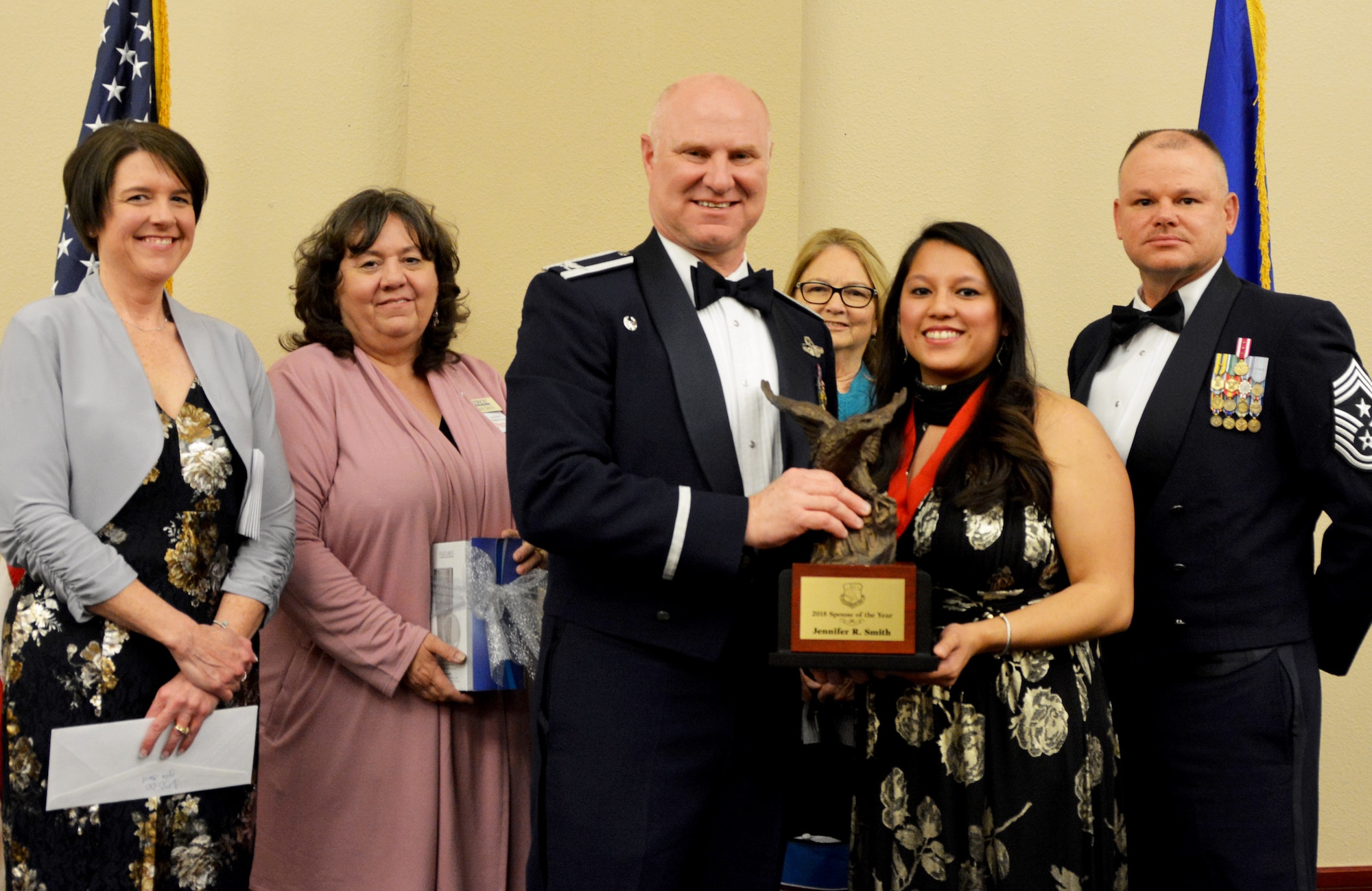 Col. Miles Heaslip, 507th Air Refueling Wing commander, and Chief Master Sgt. David Dickson, 507th ARW command chief, along with wing community partners, present the 507th ARW Spouse of the Year award to Mrs. Jennifer Smith, March 2, 2019, in Midwest City, Oklahoma. (U.S. Air Force photo by Maj. Jon Quinlan)