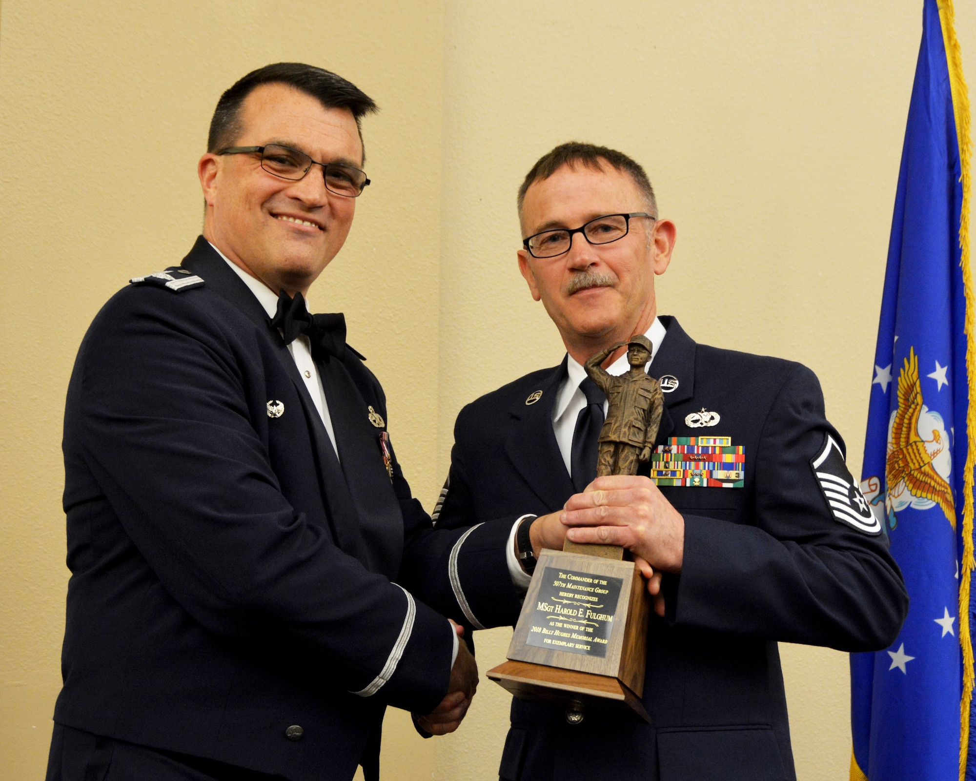 Lt. Col. Bradley Garcia, 507th Maintenance Group deputy commander, presents the 2018 507th MXG Billy Hughes Memorial Award for exemplary service to Master Sgt. Harold Fulghum, 507th Maintenance Squadron, March 2, 2019, Midwest City, Oklahoma. (U.S. Air Force photo by Maj. Jon Quinlan)