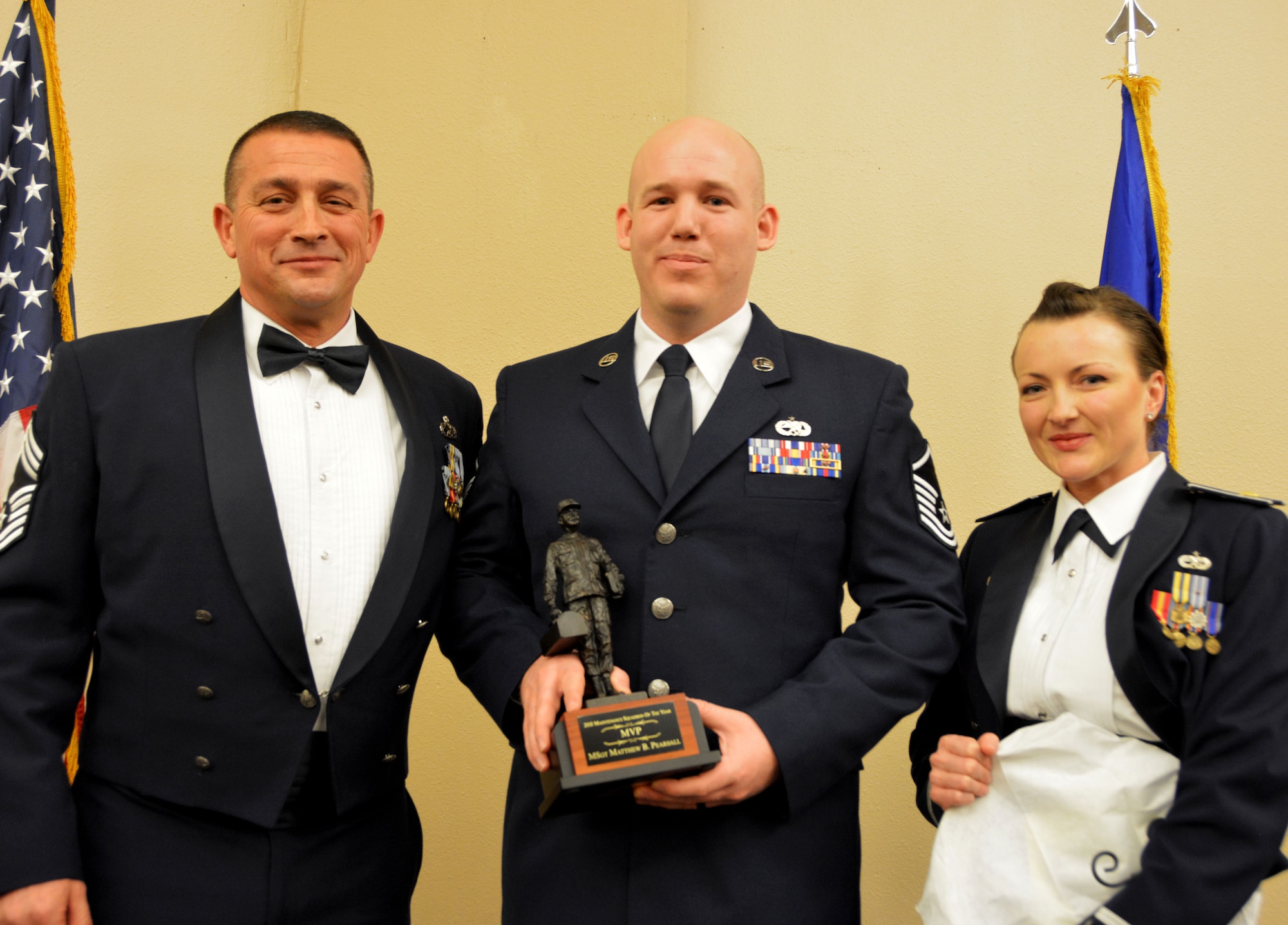 Chief Master Sgt. Richard Stull, 507th Maintenance Squadron superintendent, and Maj. Melissa Jones, 507th MXS commander, present the 2018 507th Maintenance Squadron MVP of the Year award to Master Sgt. Matthew Pearsall, March 2, 2019, in Midwest City, Oklahoma. (U.S. Air Force photo by Maj. Jon Quinlan)