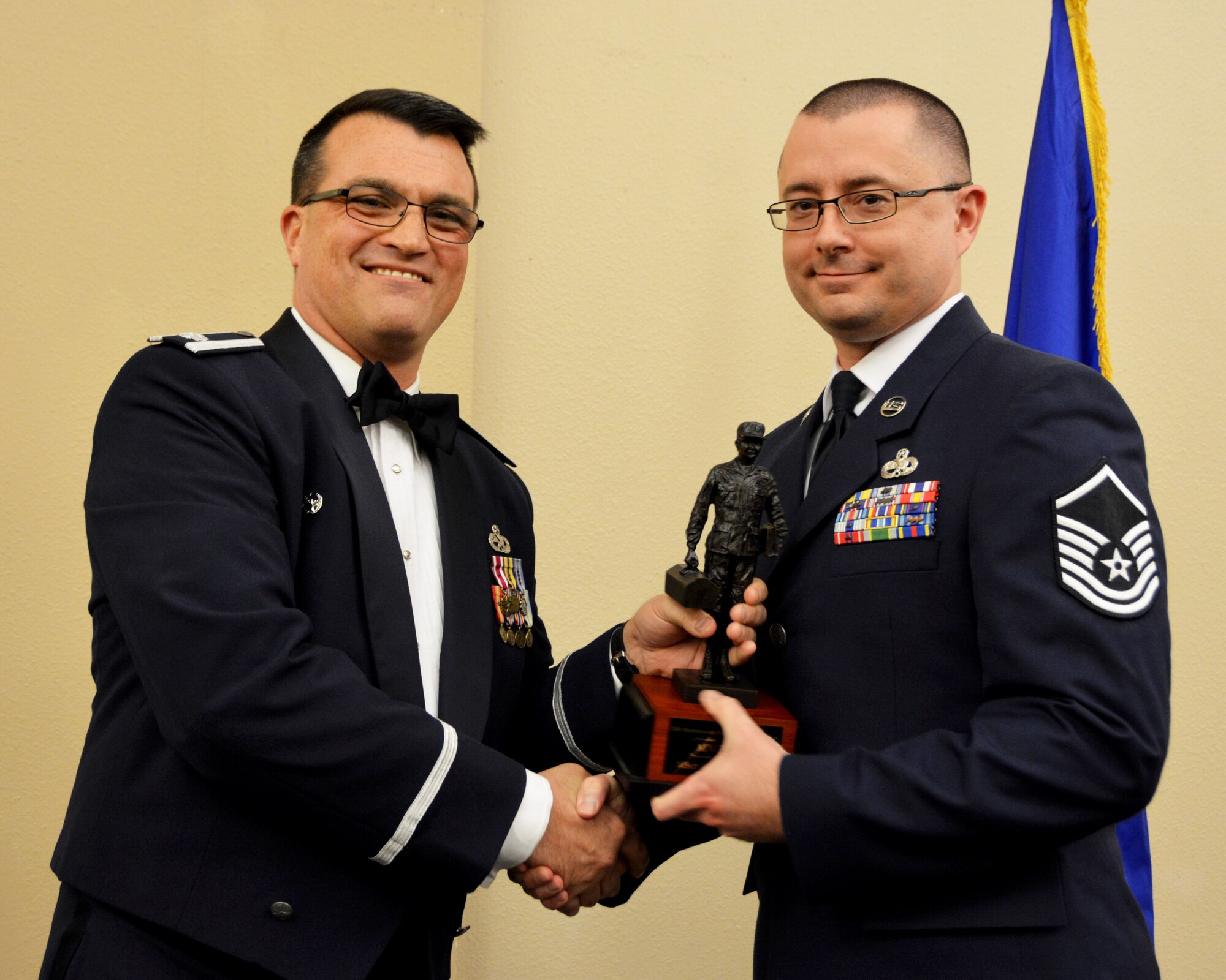 Lt. Col. Bradley Garcia, 507th Maintenance Group deputy commander, presents the 2018 507th MXG MVP of the Year Award to Master Sgt. Justin Watson March 2, 2019, Midwest City, Oklahoma. (U.S. Air Force photo by Maj. Jon Quinlan)