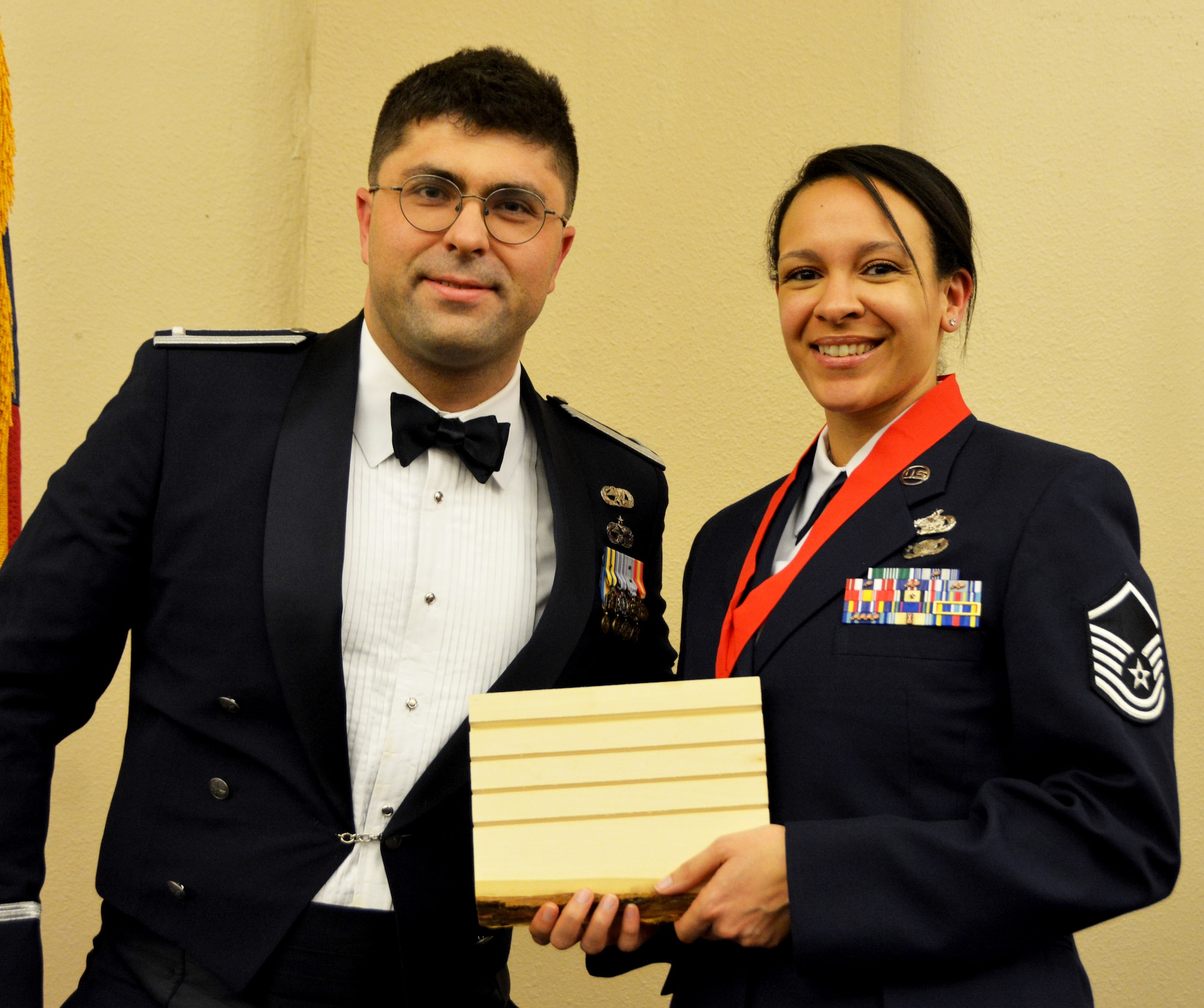 1st Lt. Jose Barreto, 507th Logistics Readiness Squadron, presents the 2018 507th LRS Logistics Professional of the Year award for outstanding performance to Master Sgt. Kayla Cuffie March 2, 2019, Midwest City, Oklahoma. (U.S. Air Force photo by Maj. Jon Quinlan)