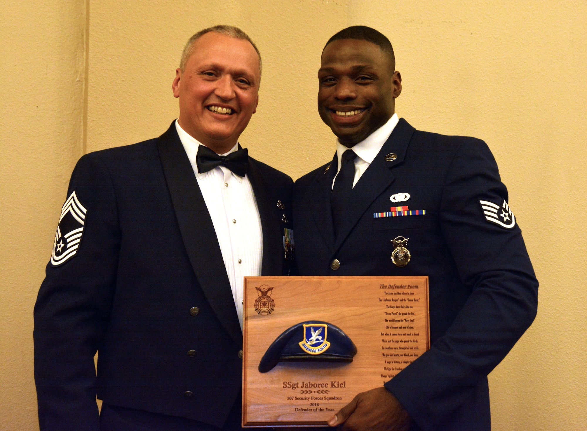 Chief Master Sgt. Nickolas Swainston, 507th Security Forces Squadron, presents the 2018 507th SFS Defender of the Year award for outstanding performance to Staff Sgt. Jaboree Kiel March 2, 2019, in Midwest City, Oklahoma. (U.S. Air Force photo by Maj. Jon Quinlan)