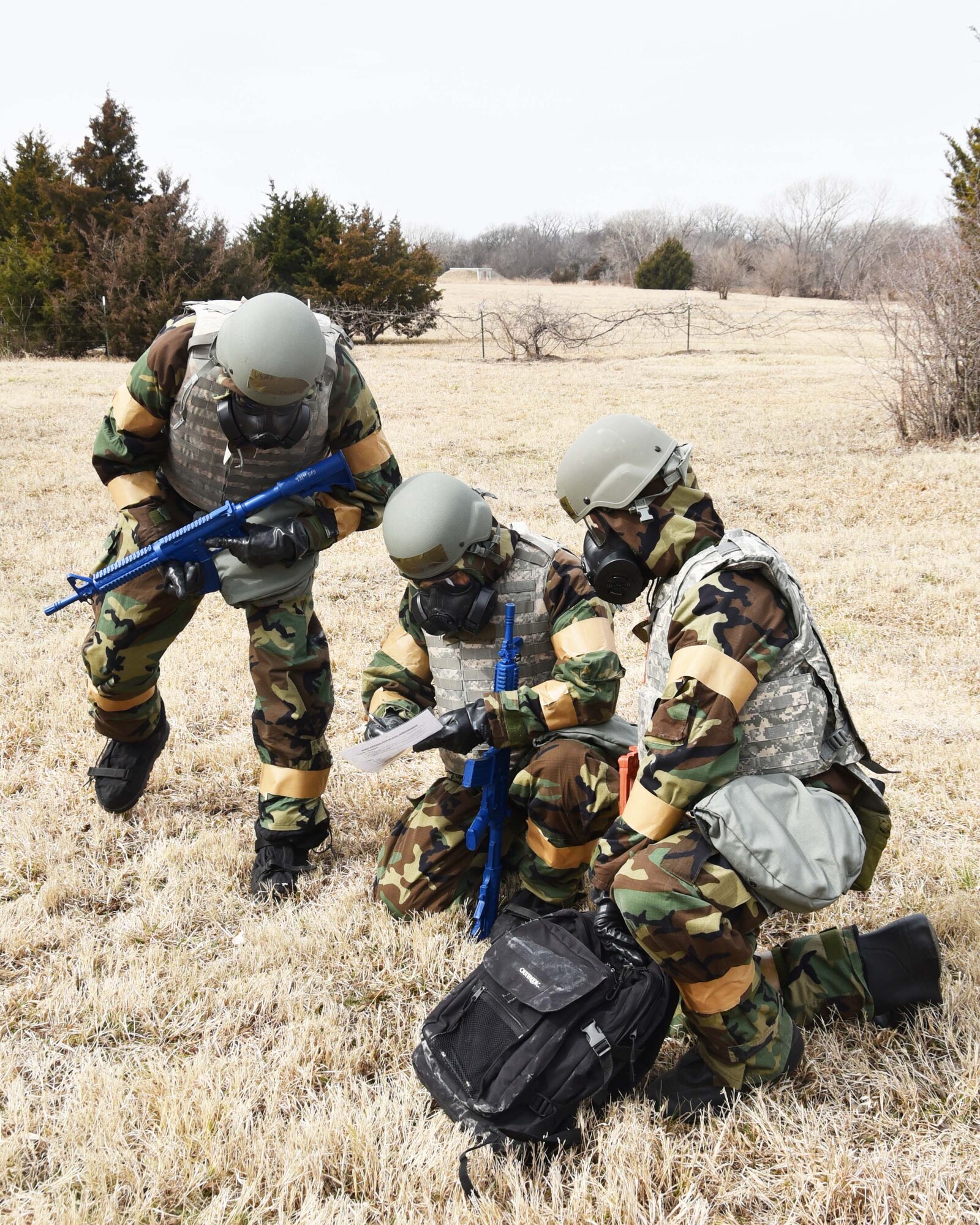 Reserve Citizen Airmen of the 931st Air Refueling Wing sweep the field for "land mines" during in an Annual Readiness Assessment March 2, 2019, McConnell Air Force Base, Kan. The exercise consisted of deployment and redeployment of troops to and from an assigned location, the performance of self-aid and buddy care (SABC), contamination avoidance, warning and alarm signals, reporting, and the performance of protective postures (MOPP).  (U.S. Air Force photo by Tech. Sgt. Abigail Klein)